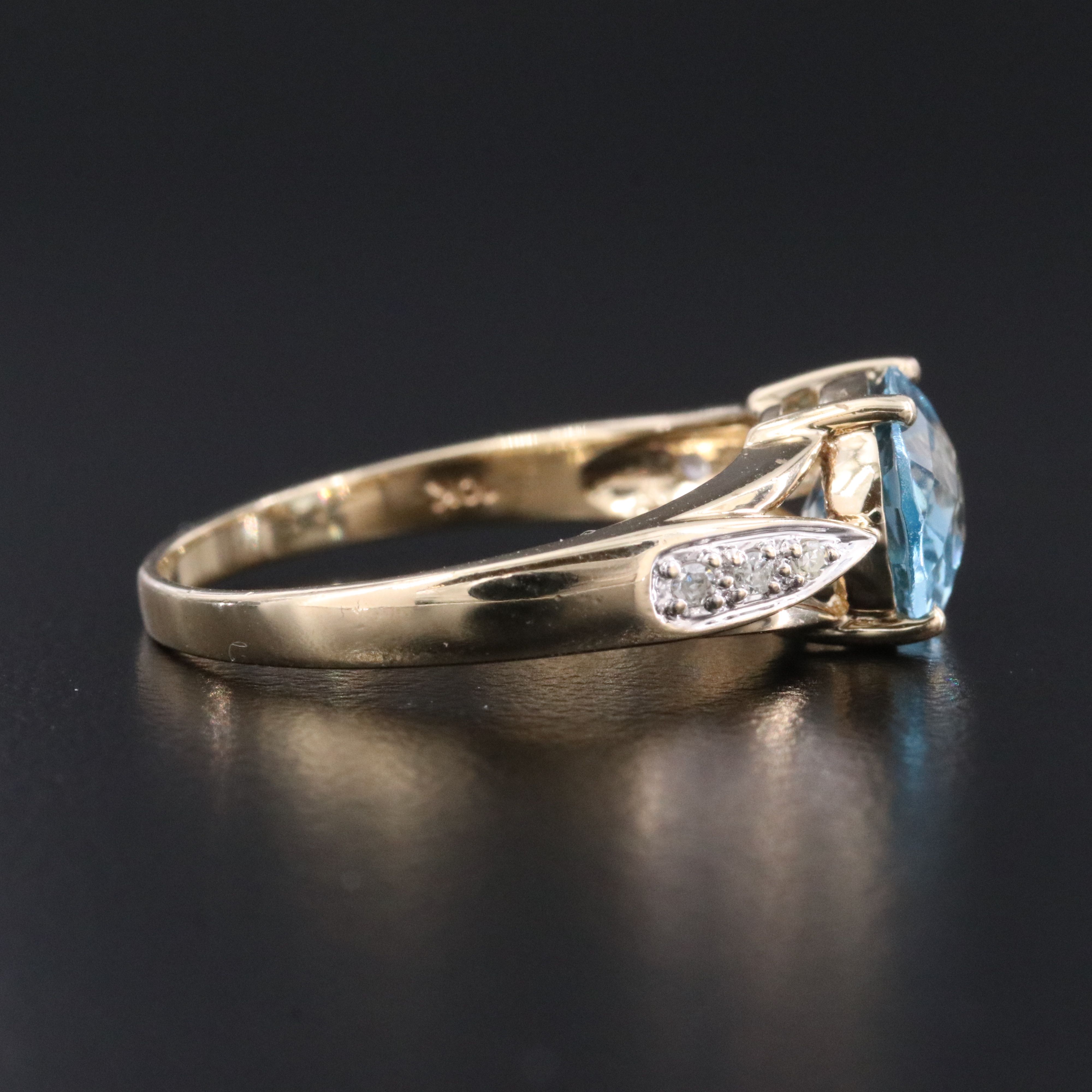 10K Swiss Blue Topaz and Diamond East West Ring