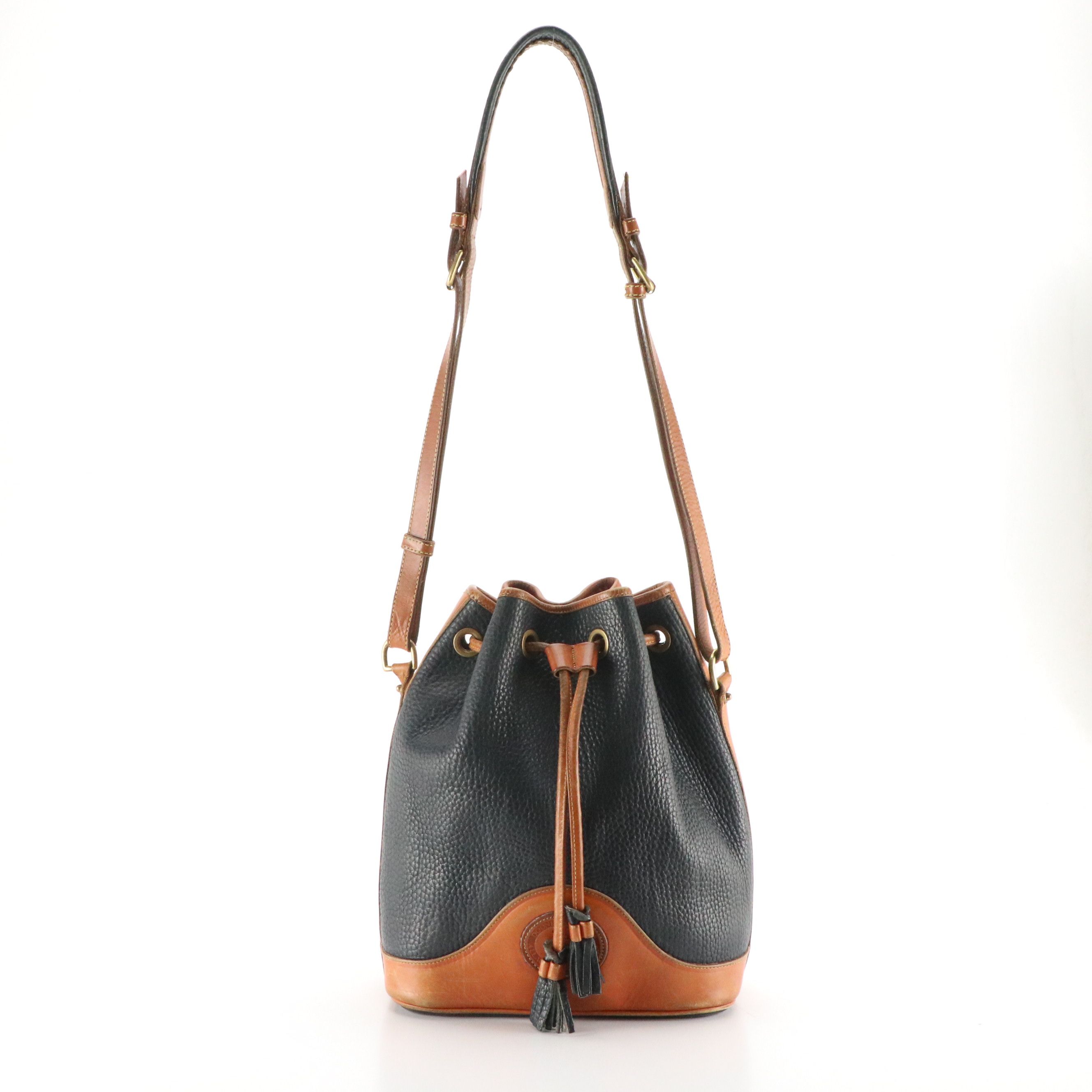 Dooney & Bourke Drawstring Bucket Bag in Navy Blue All-Weather & Brown Leather