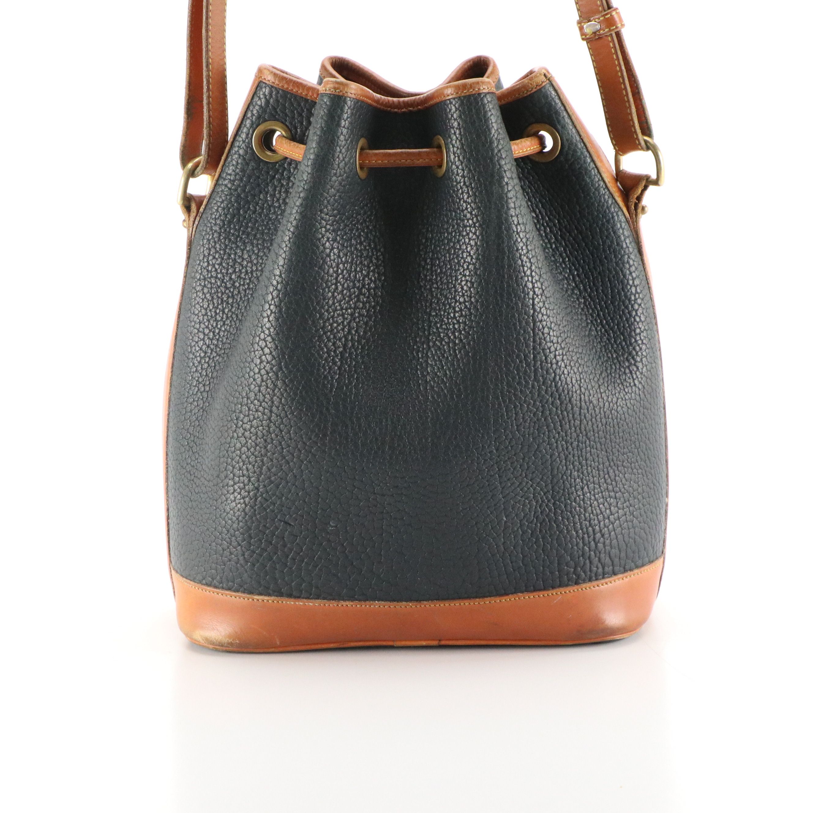 Dooney & Bourke Drawstring Bucket Bag in Navy Blue All-Weather & Brown Leather