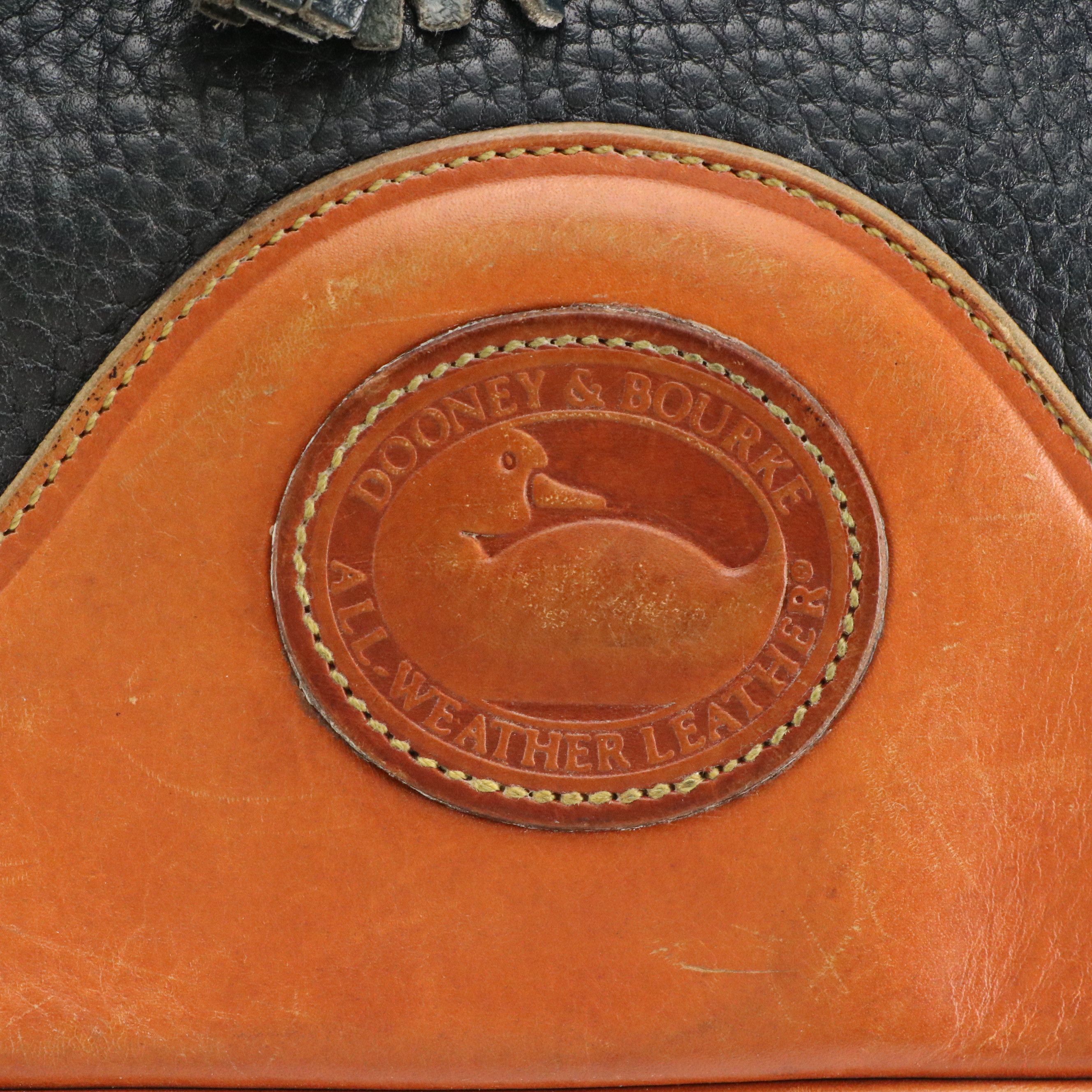 Dooney & Bourke Drawstring Bucket Bag in Navy Blue All-Weather & Brown Leather