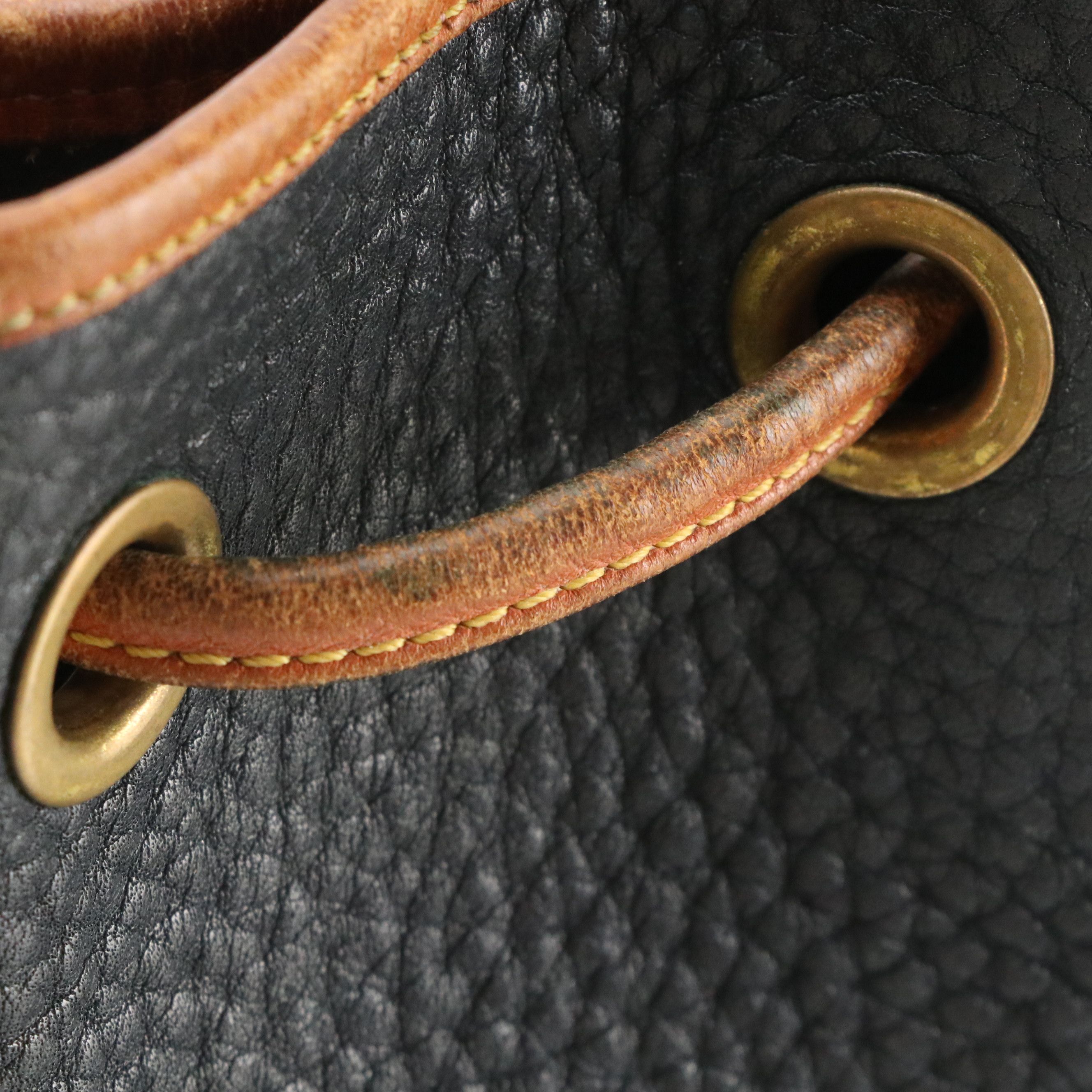 Dooney & Bourke Drawstring Bucket Bag in Navy Blue All-Weather & Brown Leather