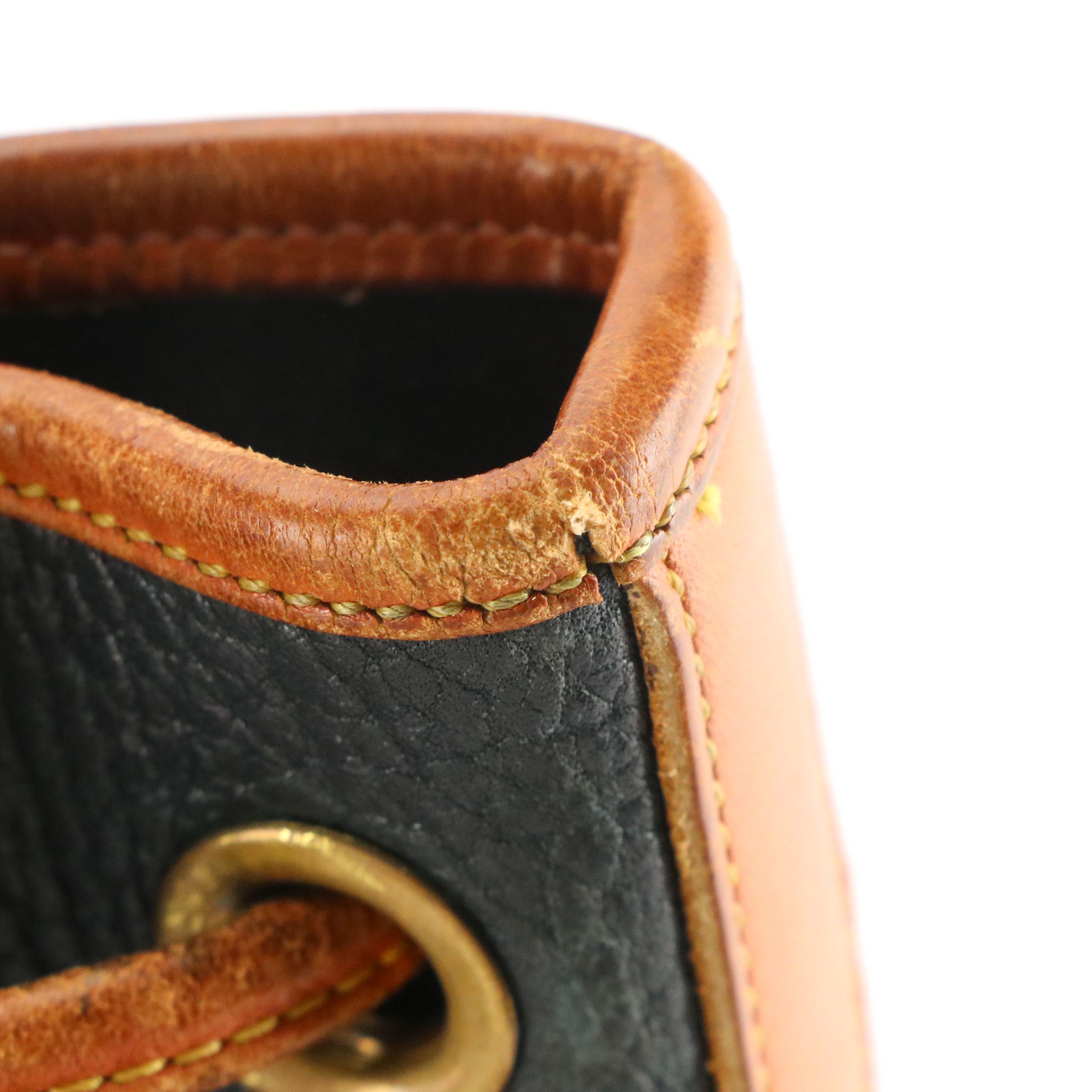 Dooney & Bourke Drawstring Bucket Bag in Navy Blue All-Weather & Brown Leather