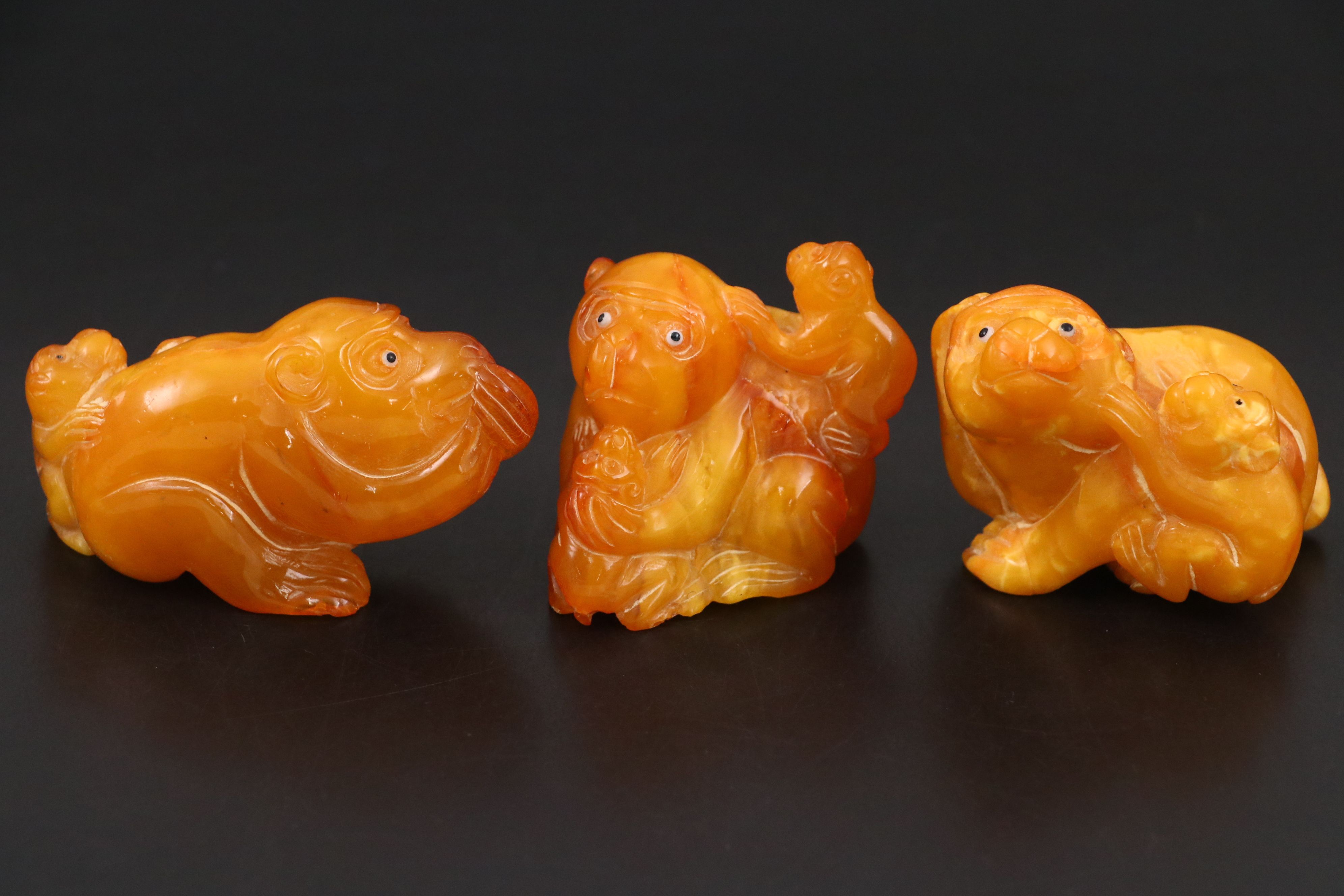 Chinese Carved Mutton Fat Amber Monkeys