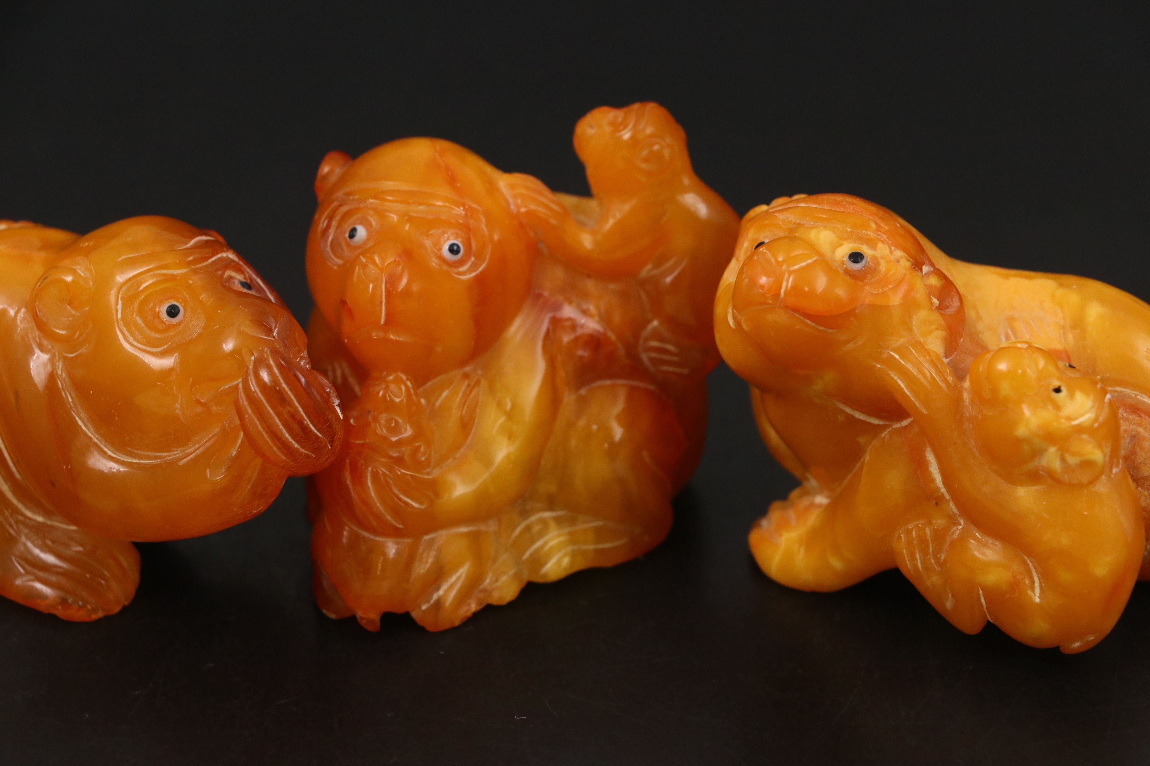 Chinese Carved Mutton Fat Amber Monkeys