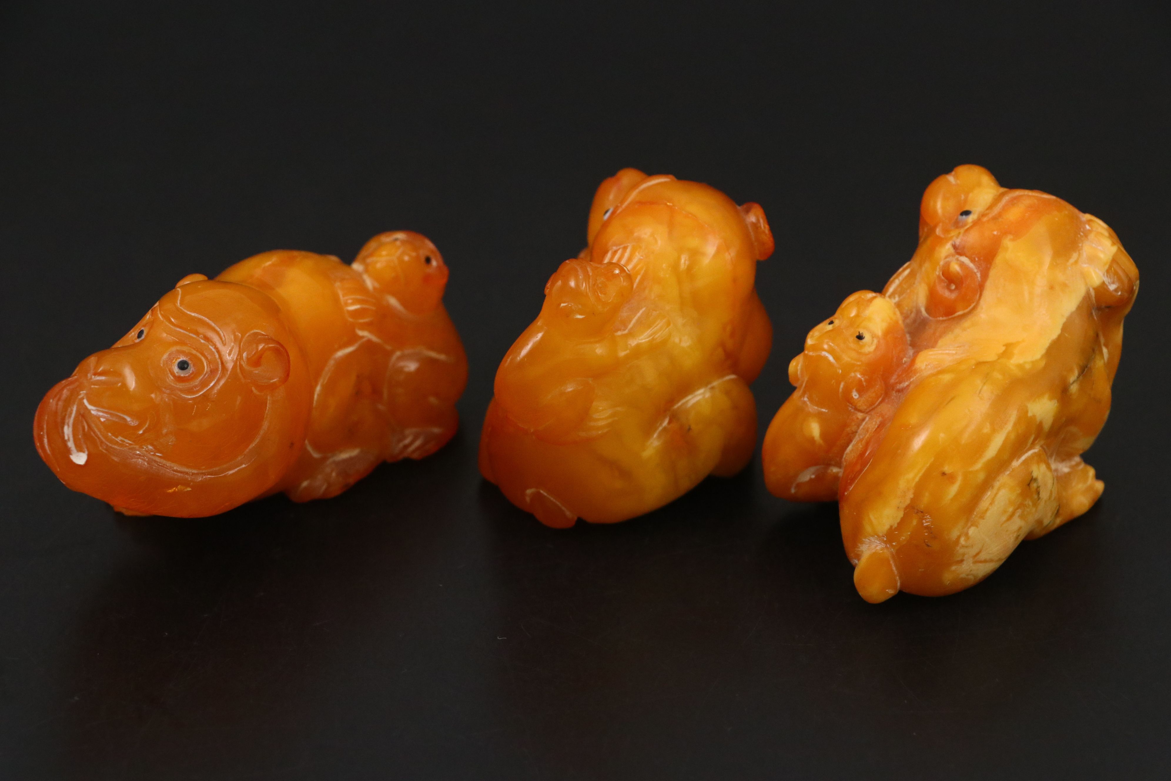 Chinese Carved Mutton Fat Amber Monkeys