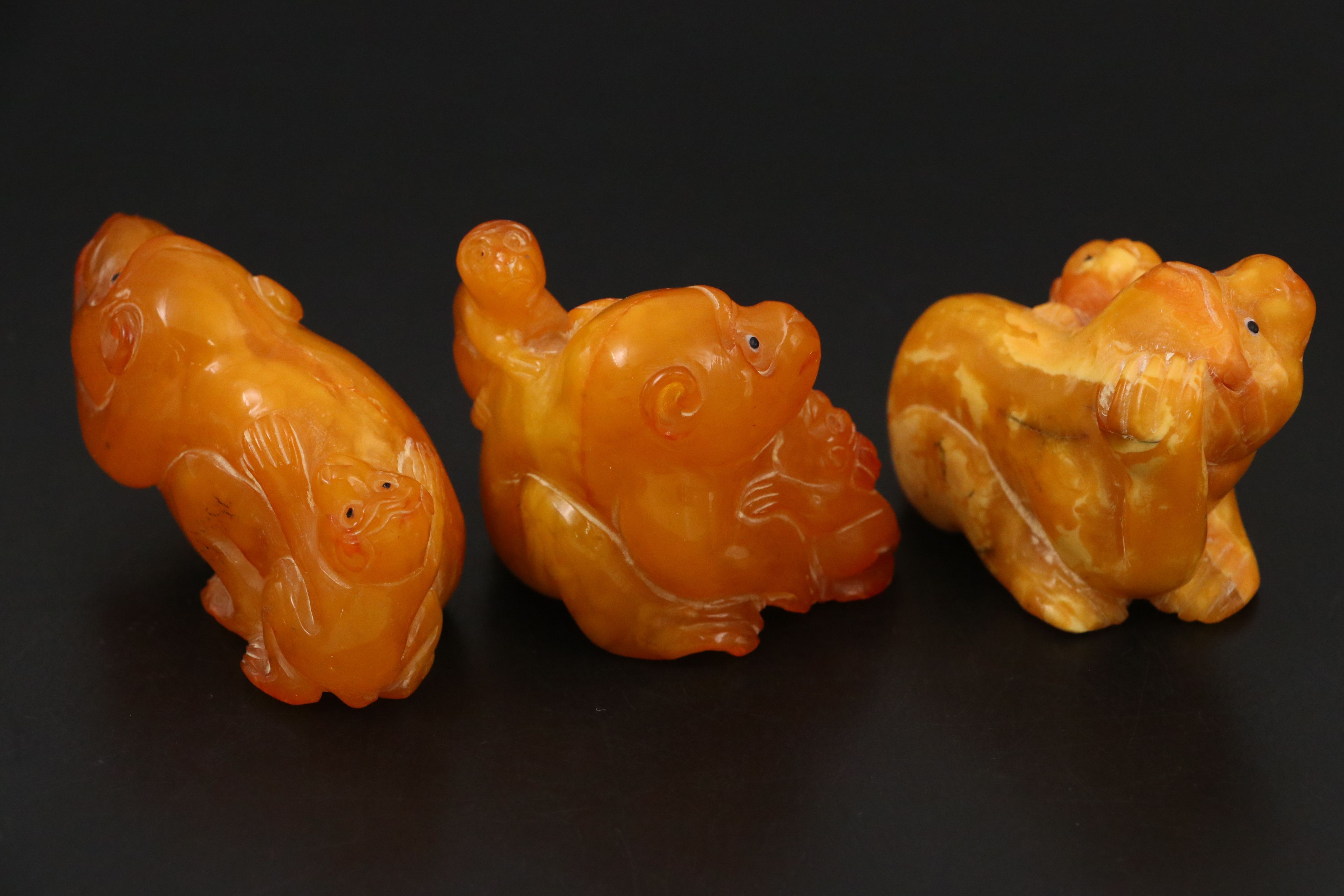 Chinese Carved Mutton Fat Amber Monkeys