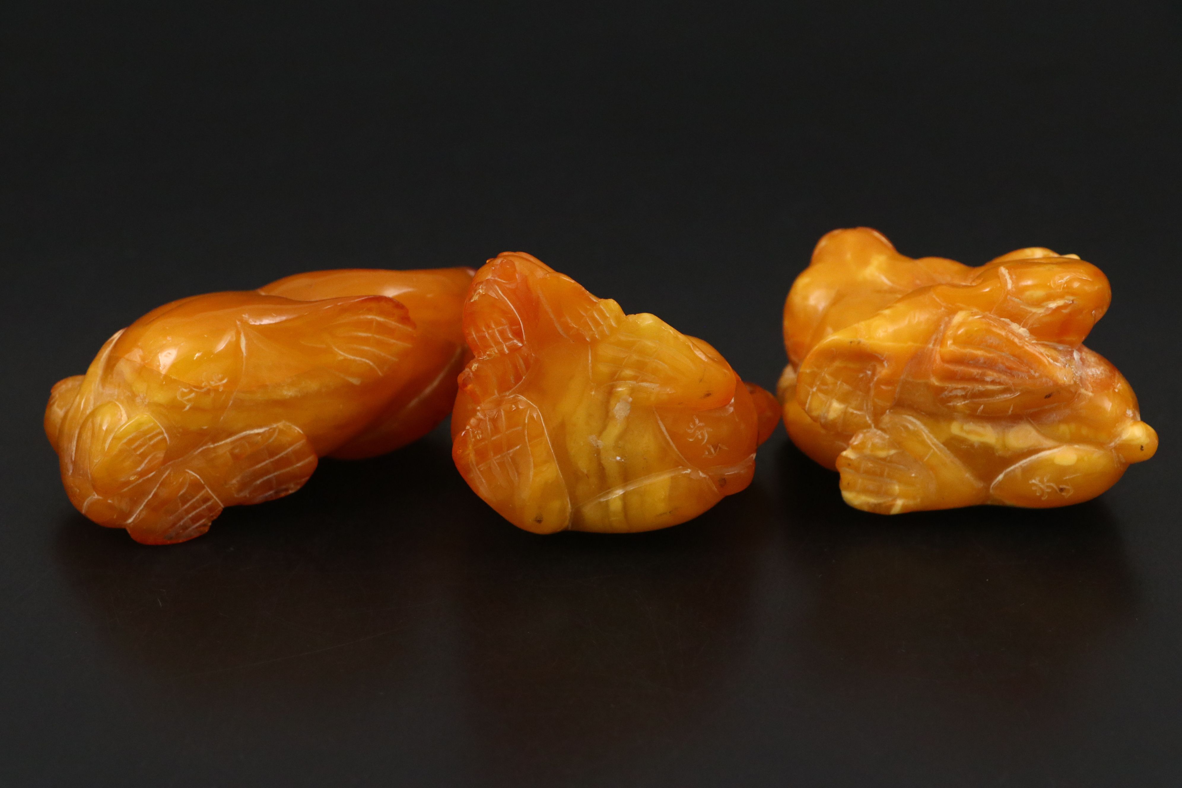 Chinese Carved Mutton Fat Amber Monkeys