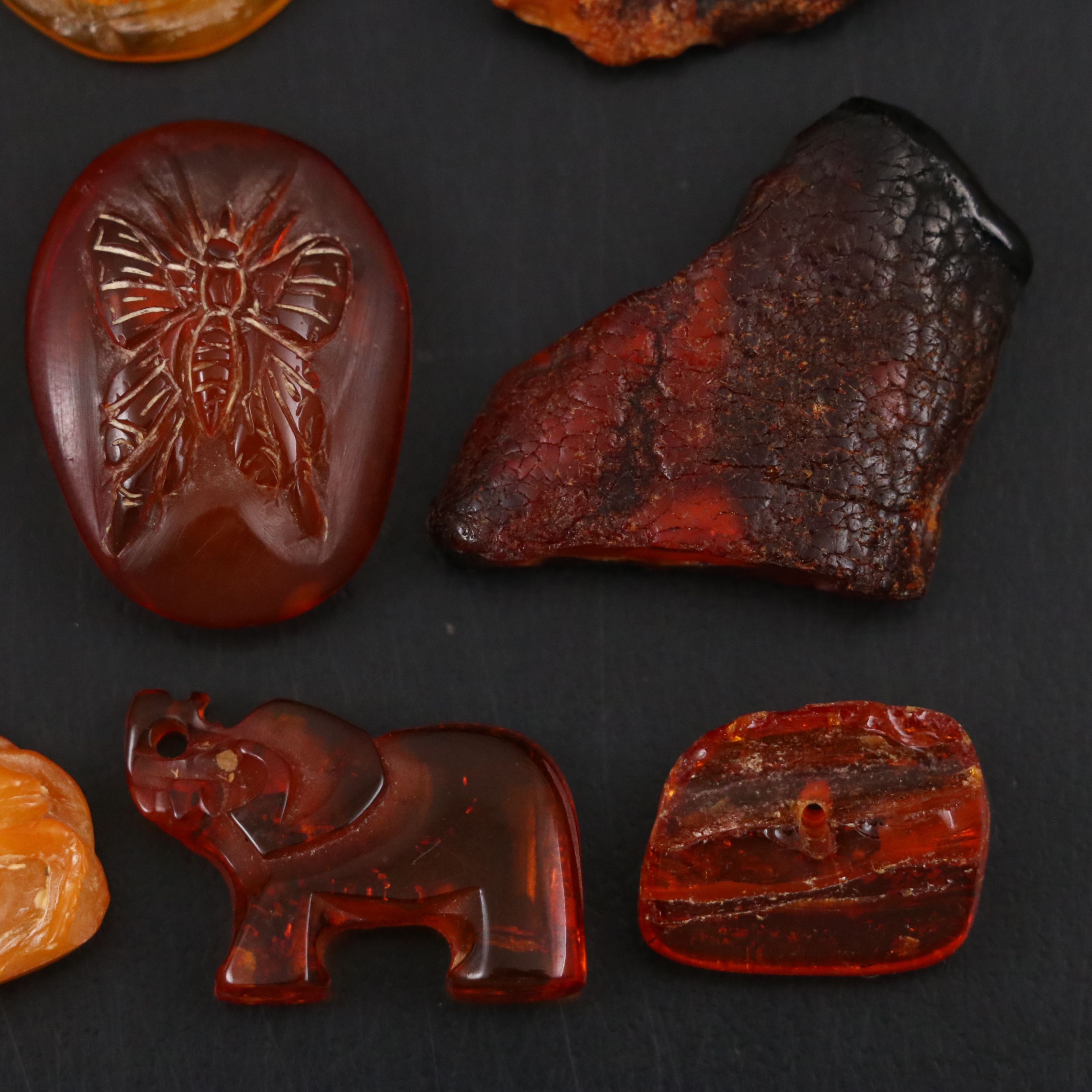 Chinese Carved Mutton Fat Amber Scarab with Other Amber Stones