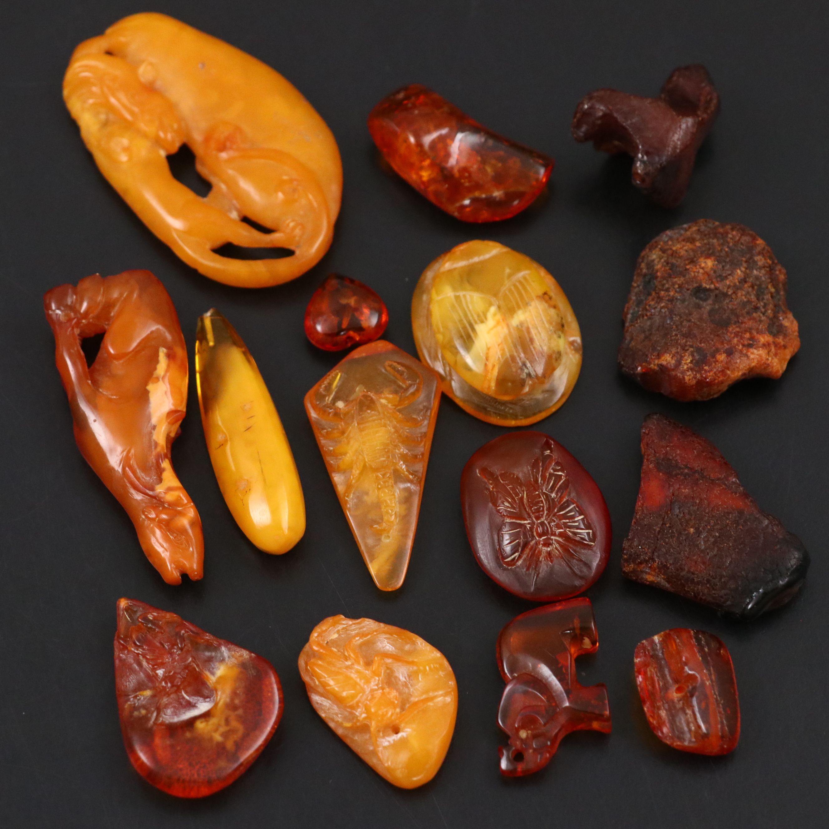 Chinese Carved Mutton Fat Amber Scarab with Other Amber Stones