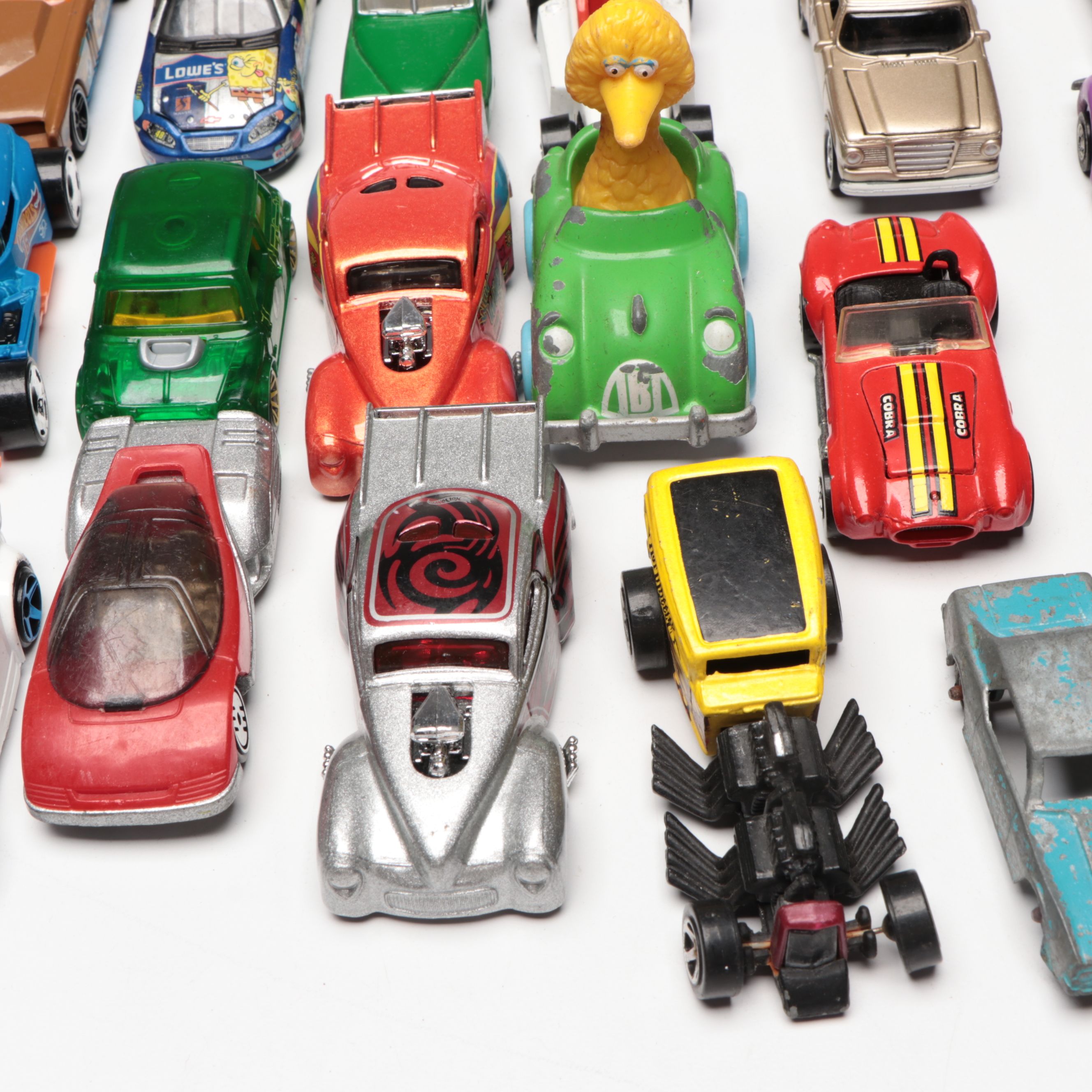Hot Wheels and Other Diecast Vehicles and Toys with Model Train Display