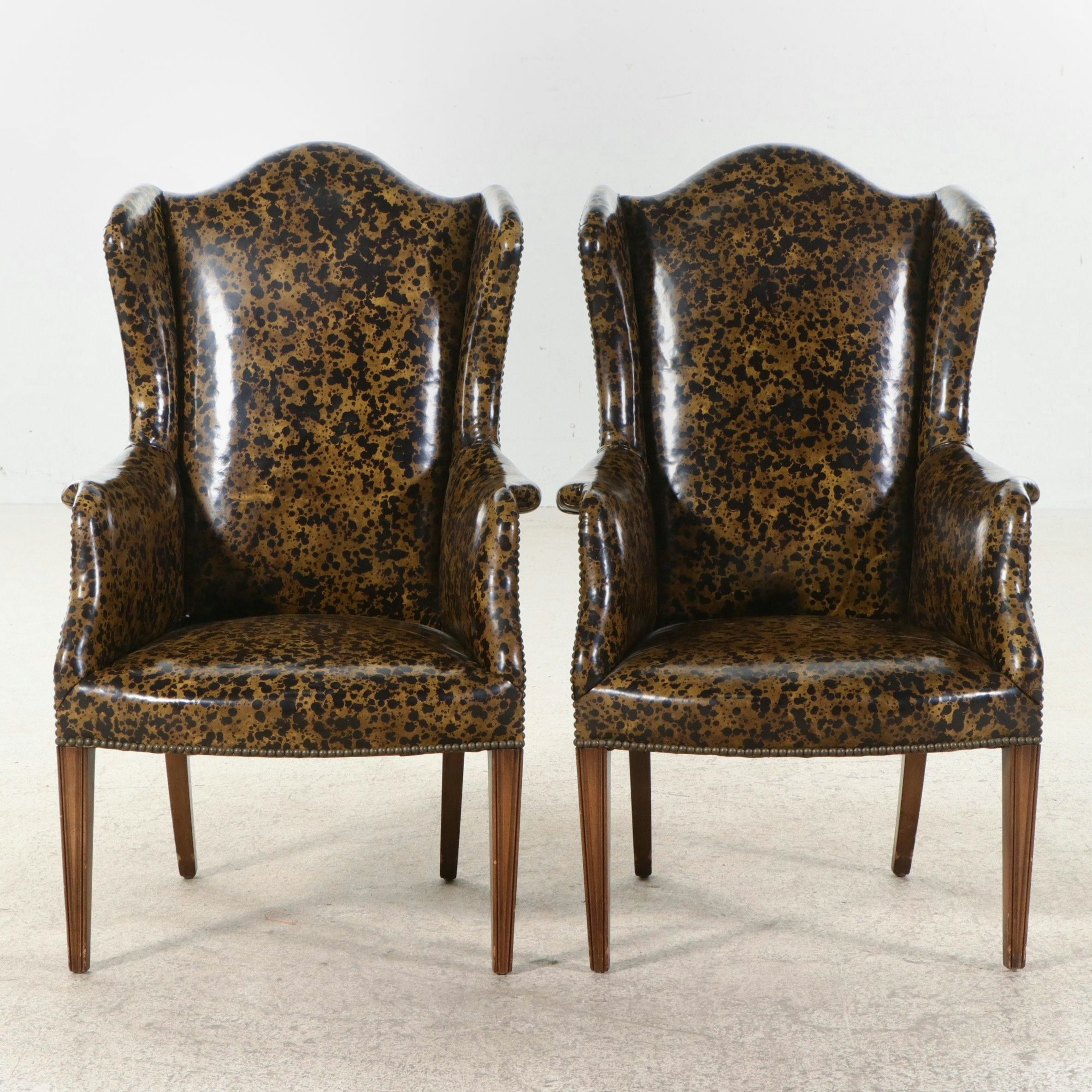 Pair of W.A. Bratburd Inc Tortoiseshell Pattern Vinyl Upholstered Wingbacks
