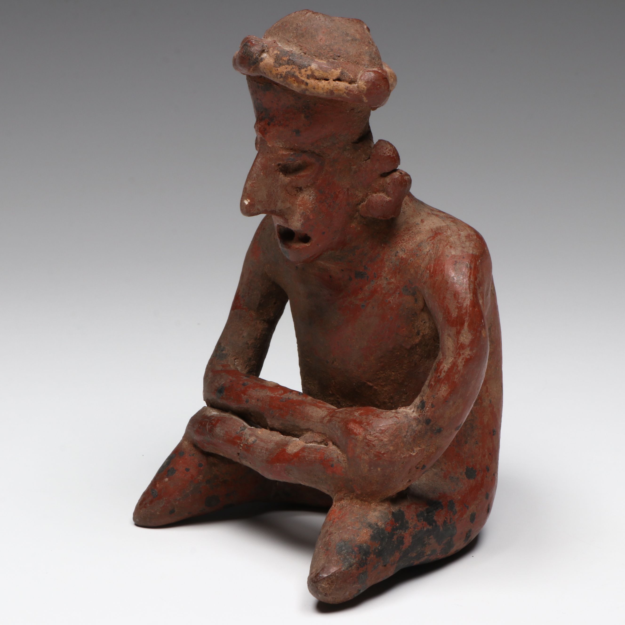 Pre-Columbian Nayarit Polychrome Seated Male, Circa 200 BCE–200 CE