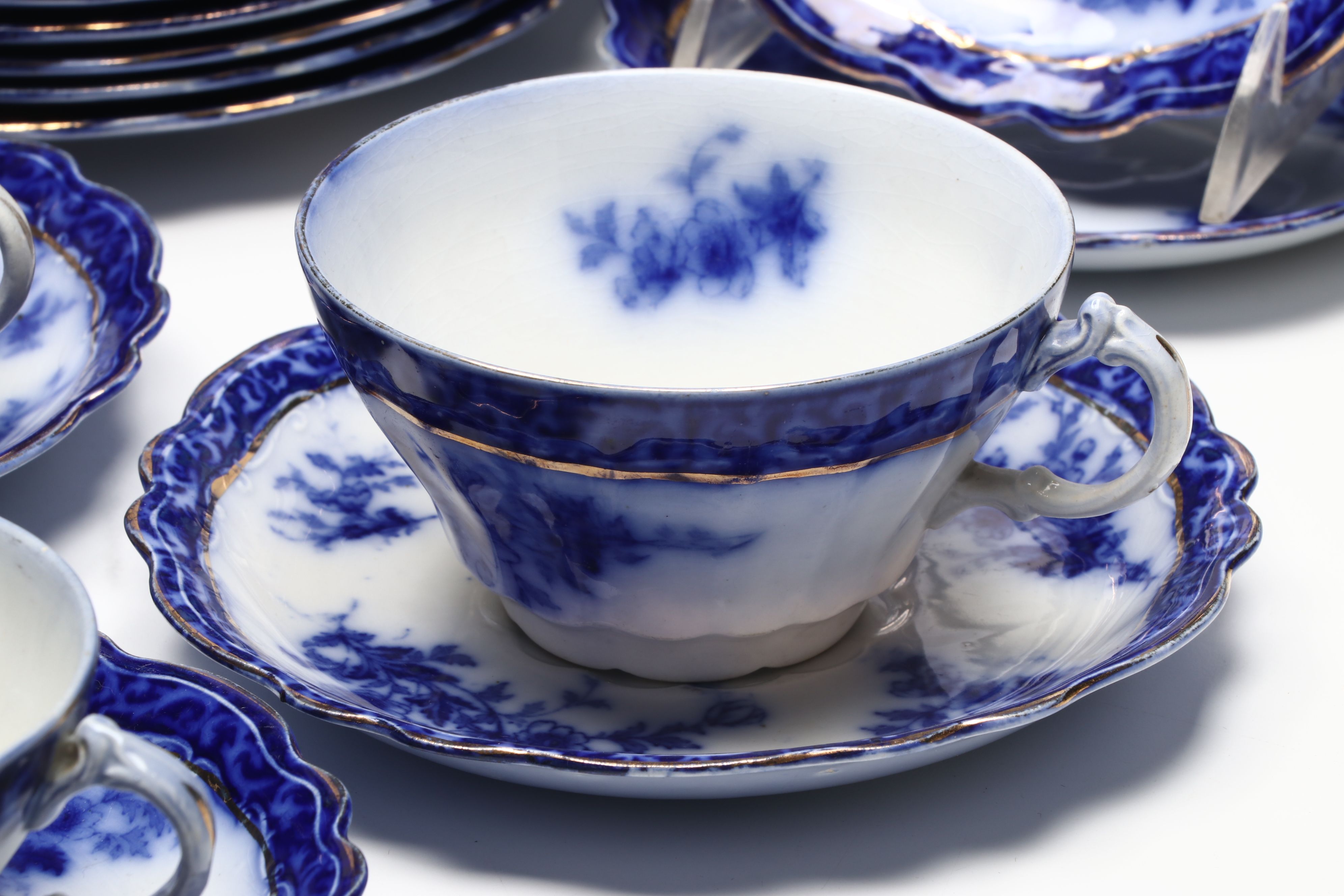 Staffordshire "Touraine Flow Blue" Teacups and Other Gilt Porcelain Tableware
