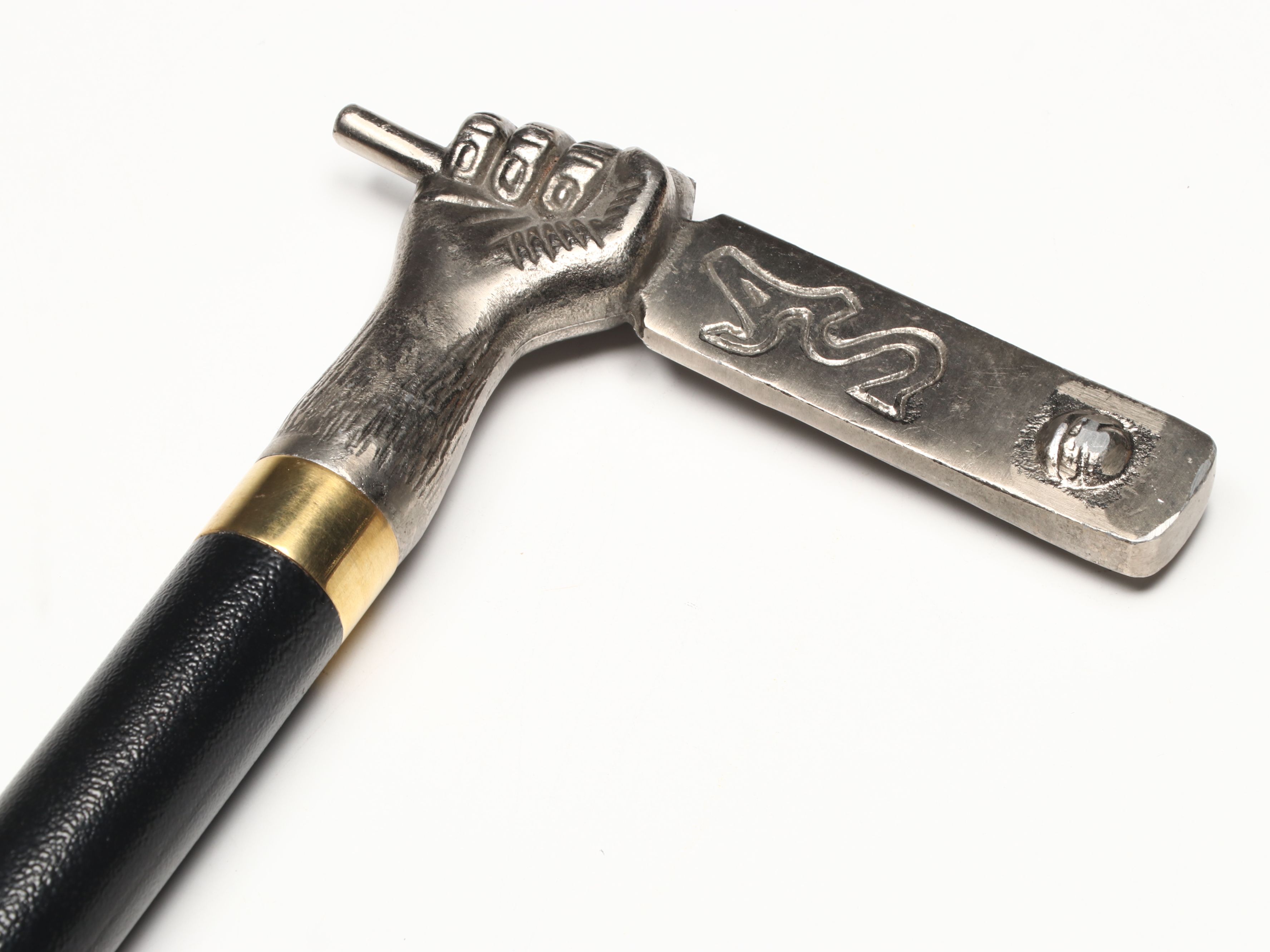 Hand Holding Paddle Handled Sword Cane