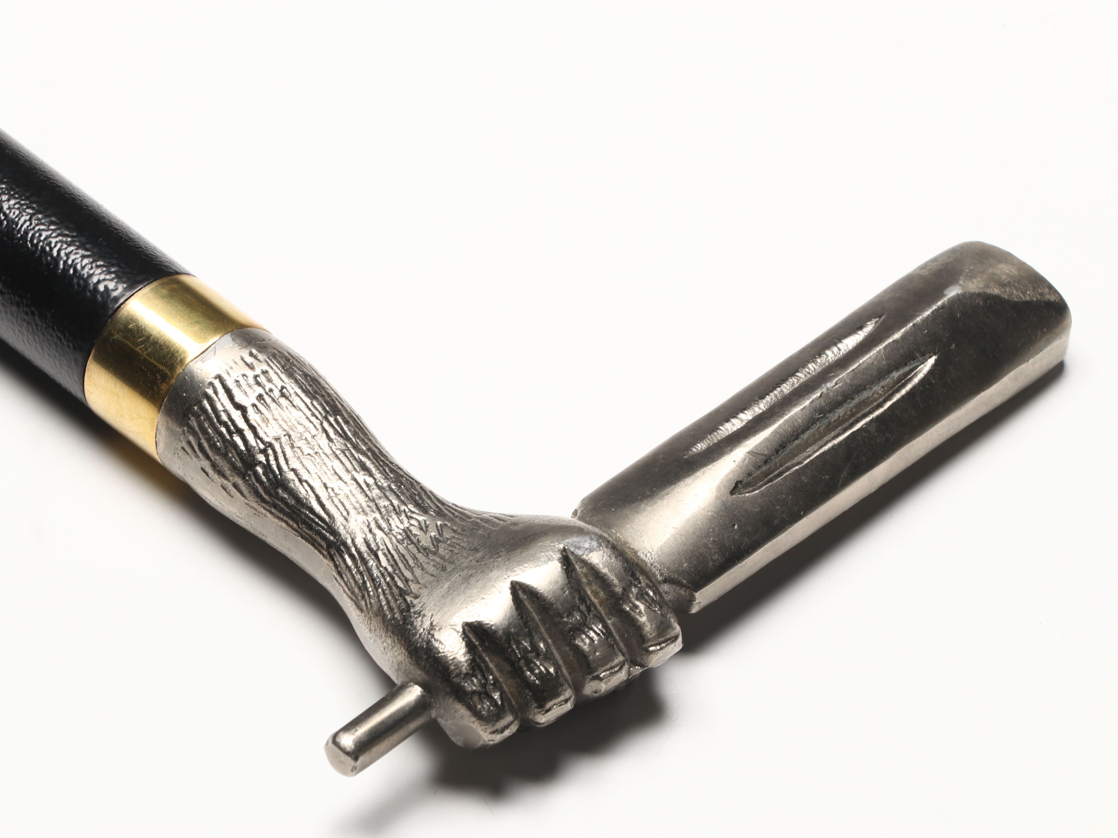 Hand Holding Paddle Handled Sword Cane