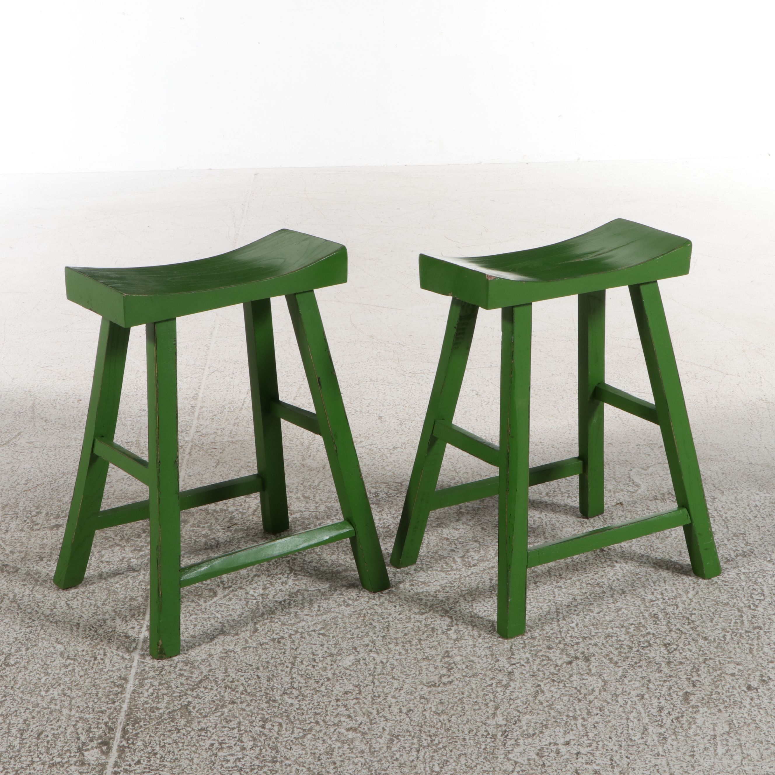 Pair of Asian-Style Green Painted Saddle Stools