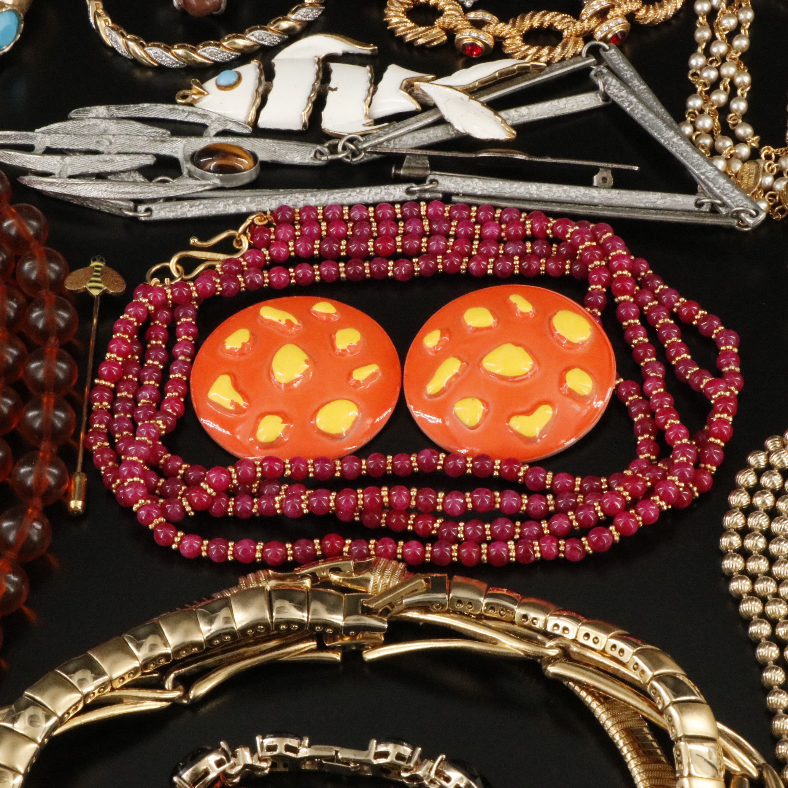 Emmons, Articulated Fish Pendants and Tiger's Eye Featured in Jewelry Assortment