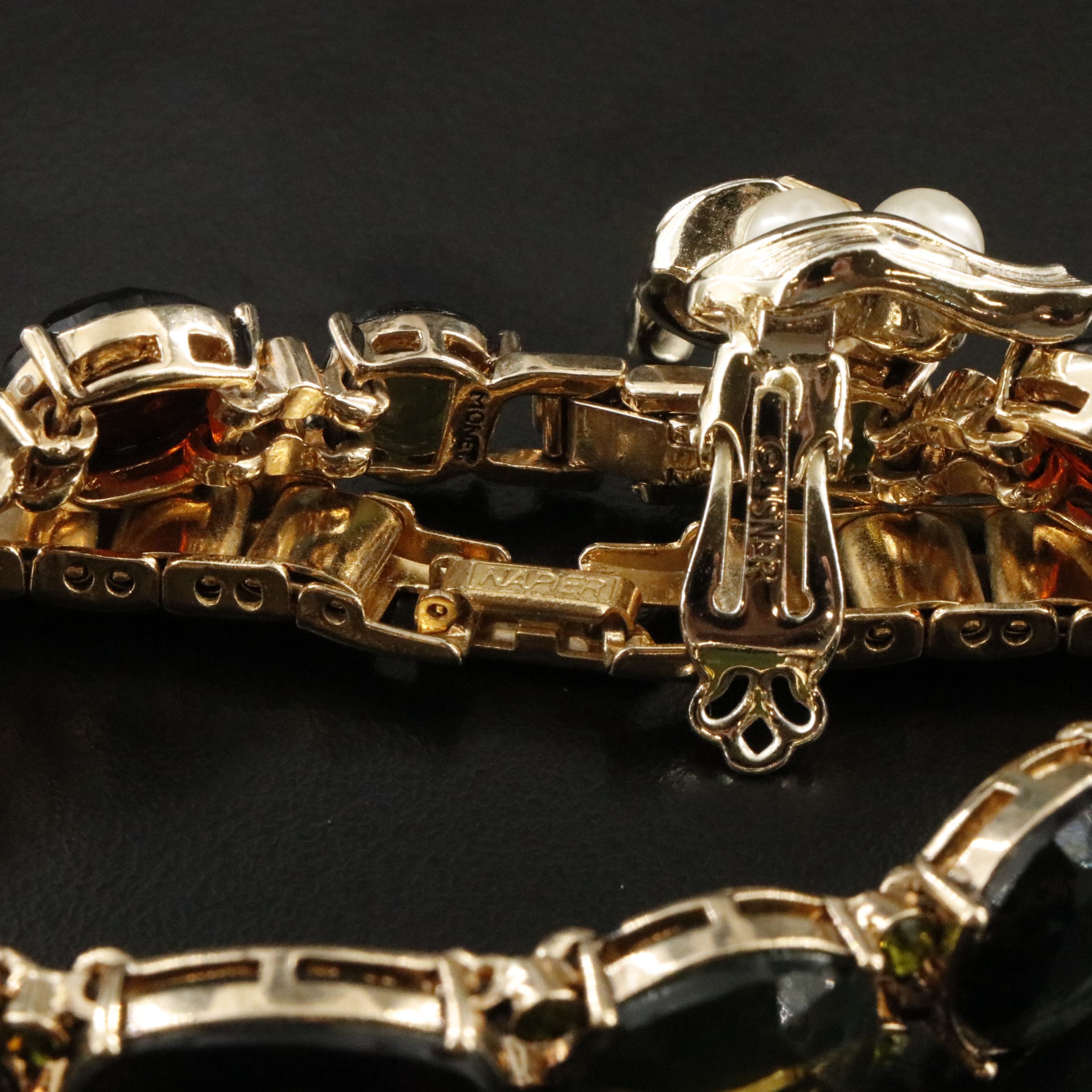 Emmons, Articulated Fish Pendants and Tiger's Eye Featured in Jewelry Assortment