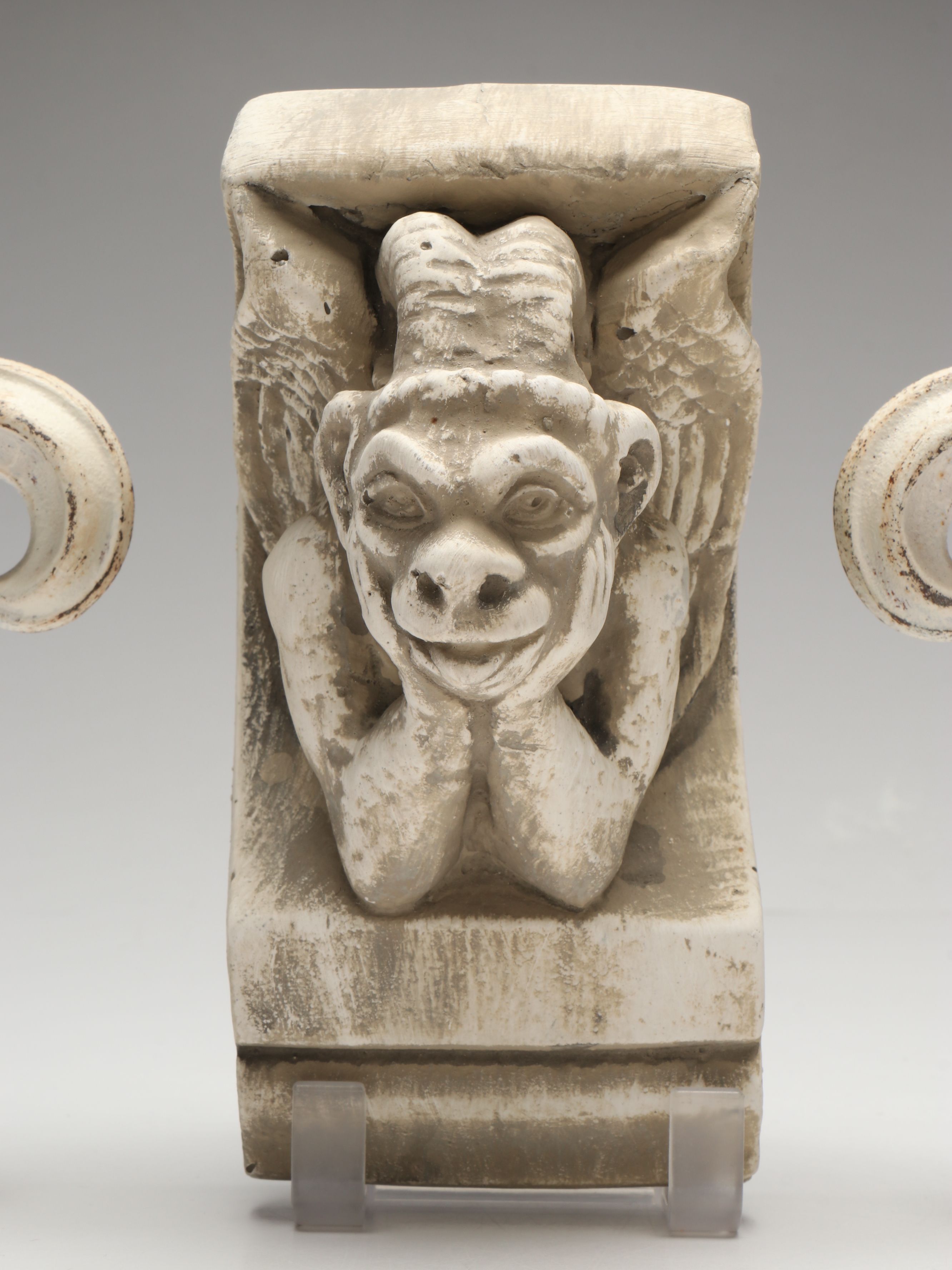 Chalkware Gargoyle and Cast Iron Fleur-de-Lis