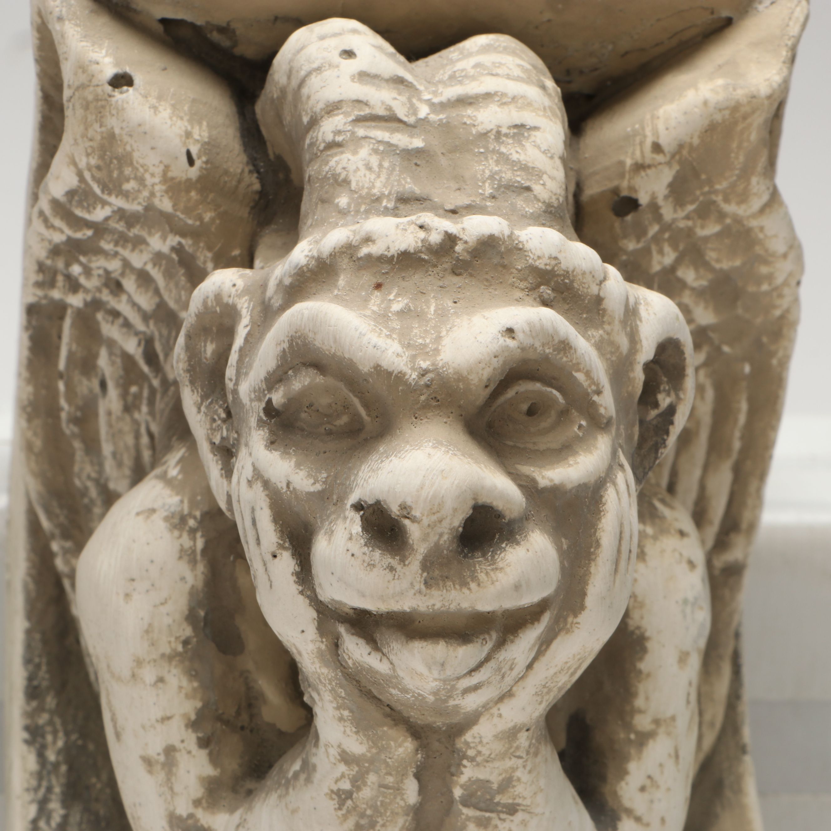 Chalkware Gargoyle and Cast Iron Fleur-de-Lis