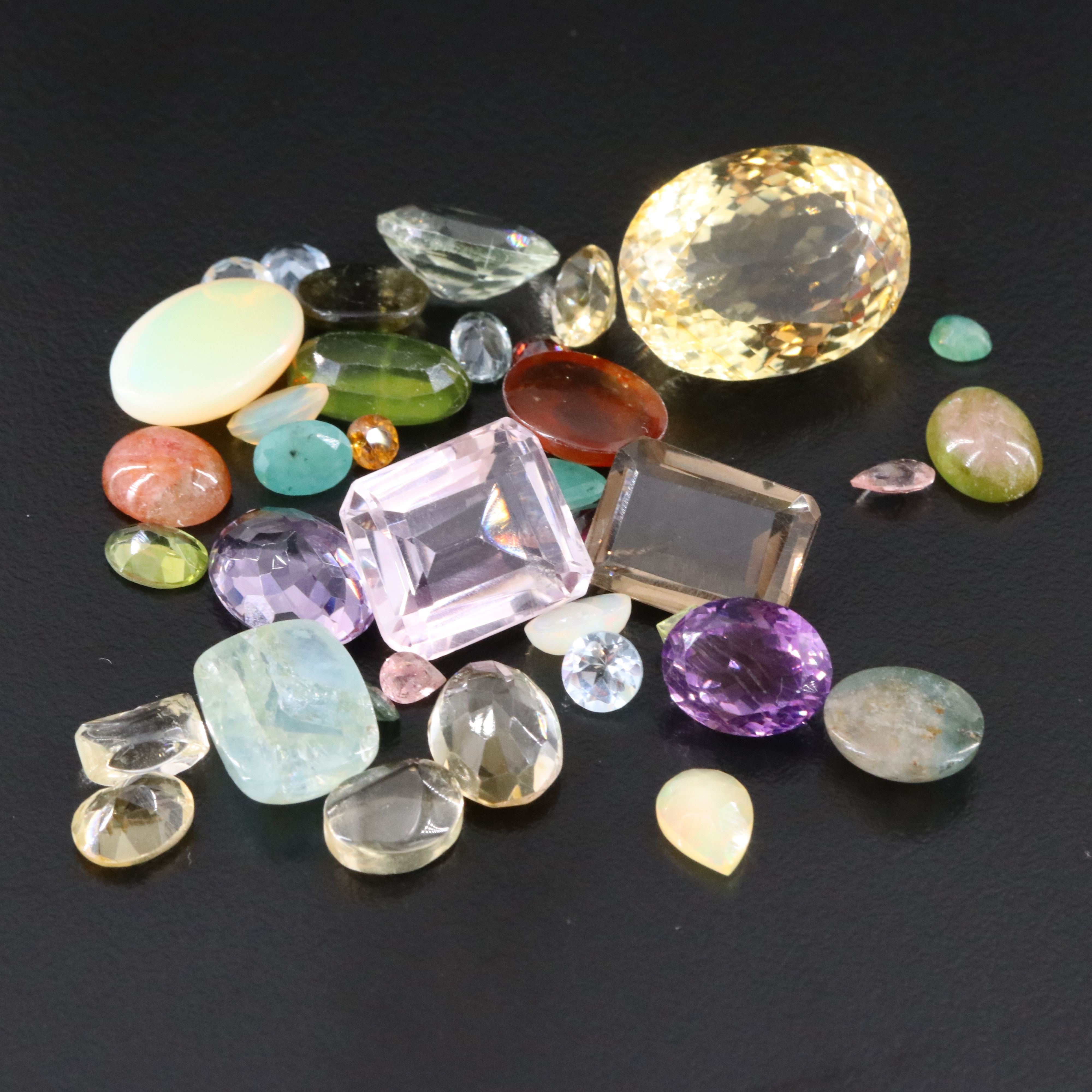Loose 96.25 CTW Gemstone Lot Including Opal, Amethyst and Peridot