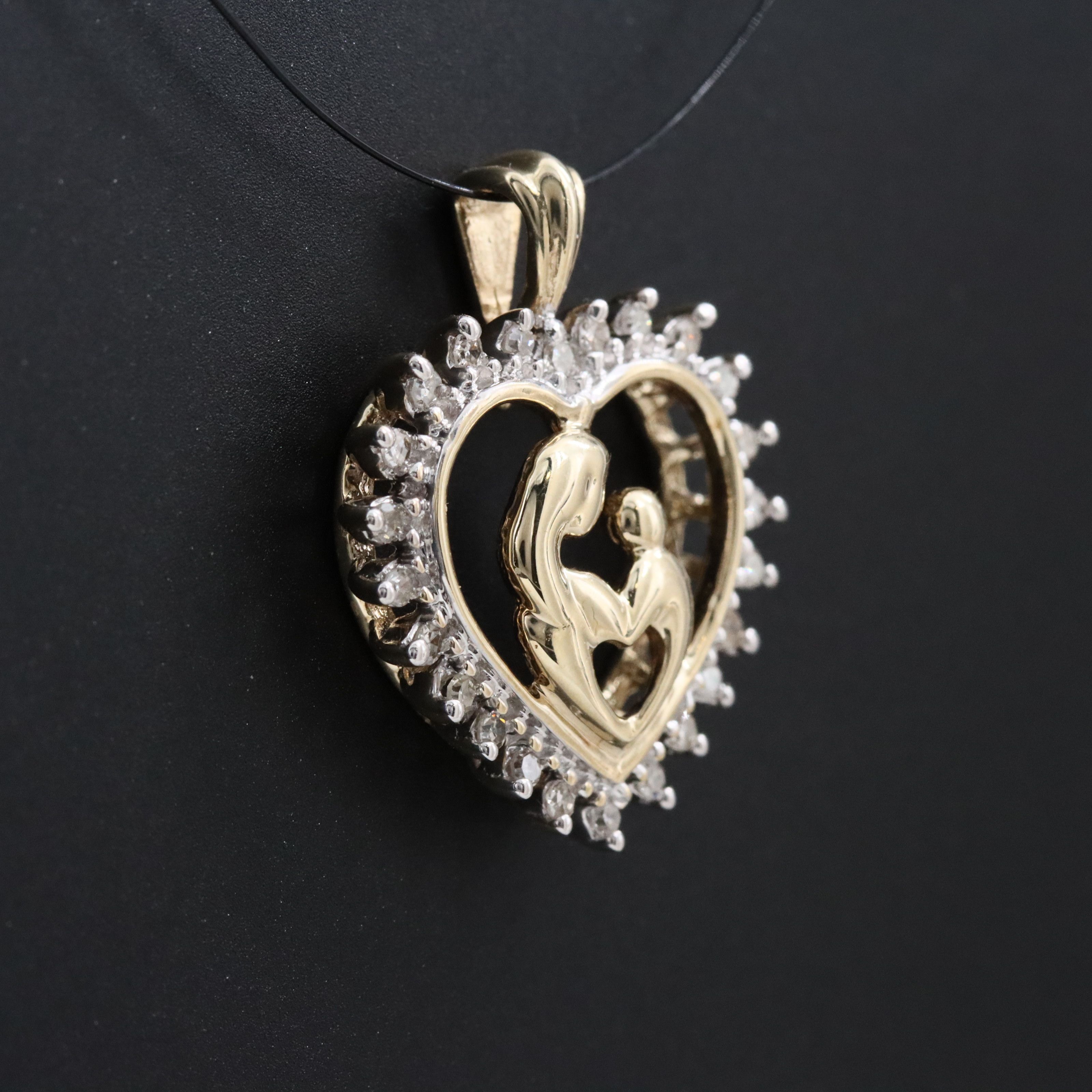 10K 0.15 CTW Diamond Mother and Child Heart Pendant