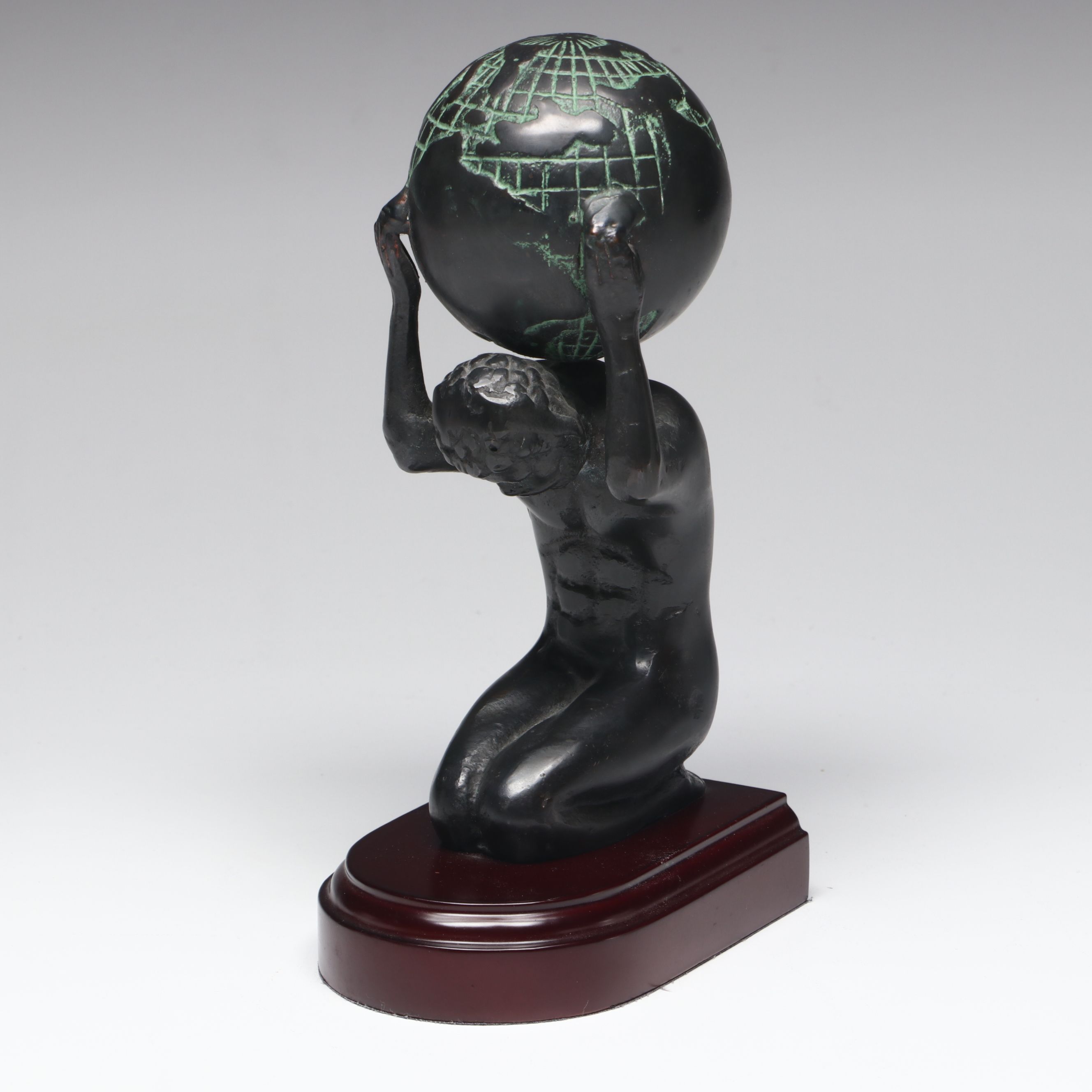 Metal Atlas Holding the World Bookends