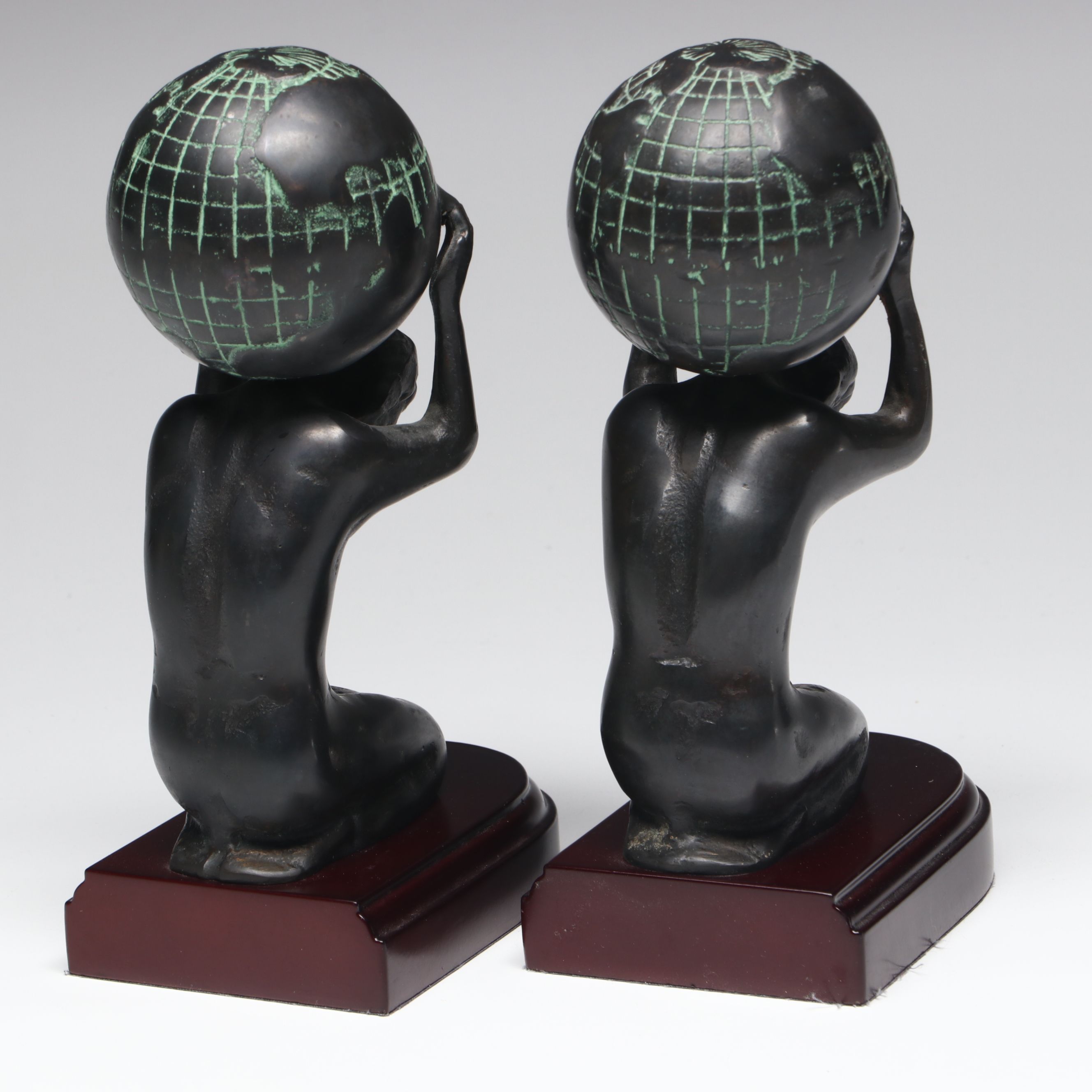 Metal Atlas Holding the World Bookends