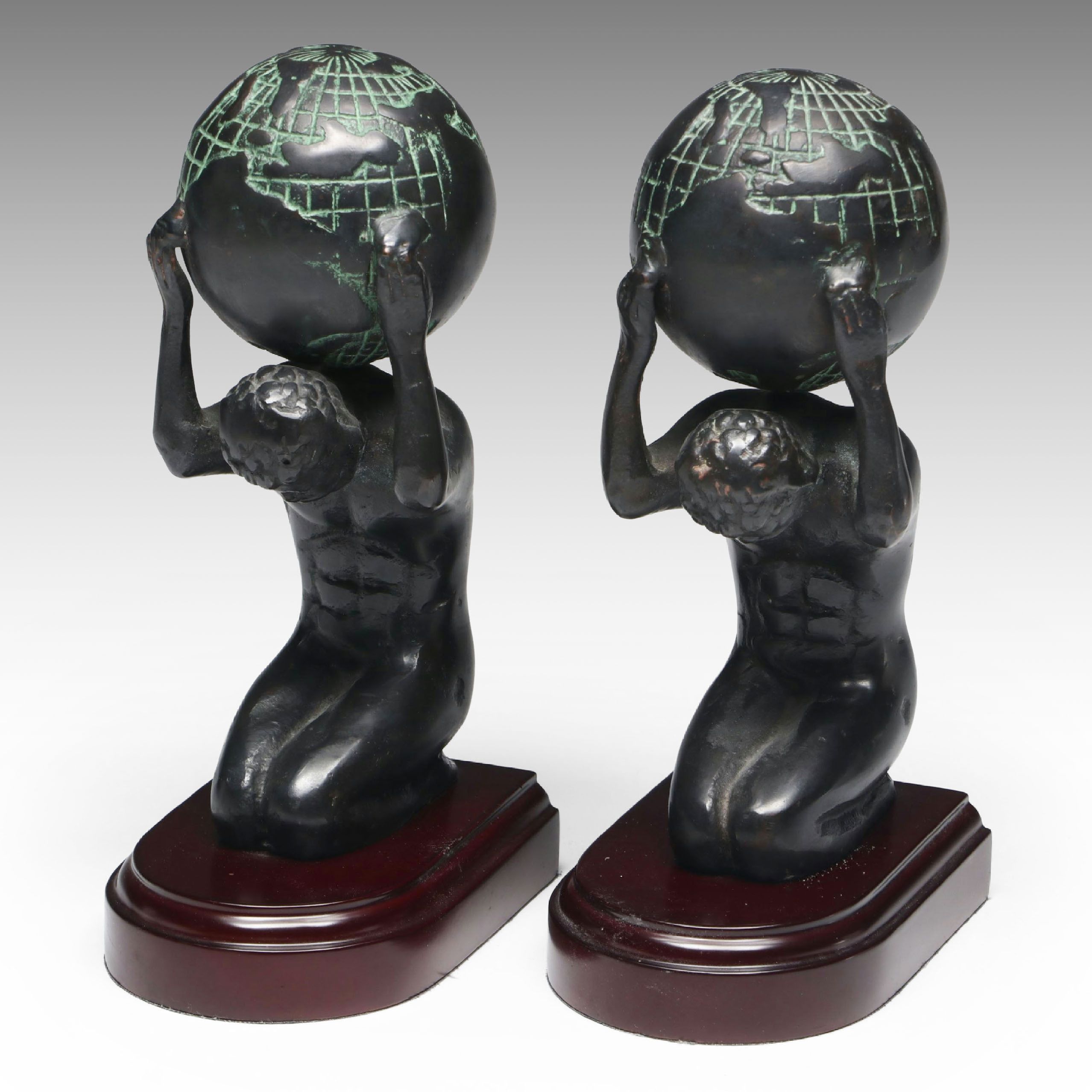 Metal Atlas Holding the World Bookends