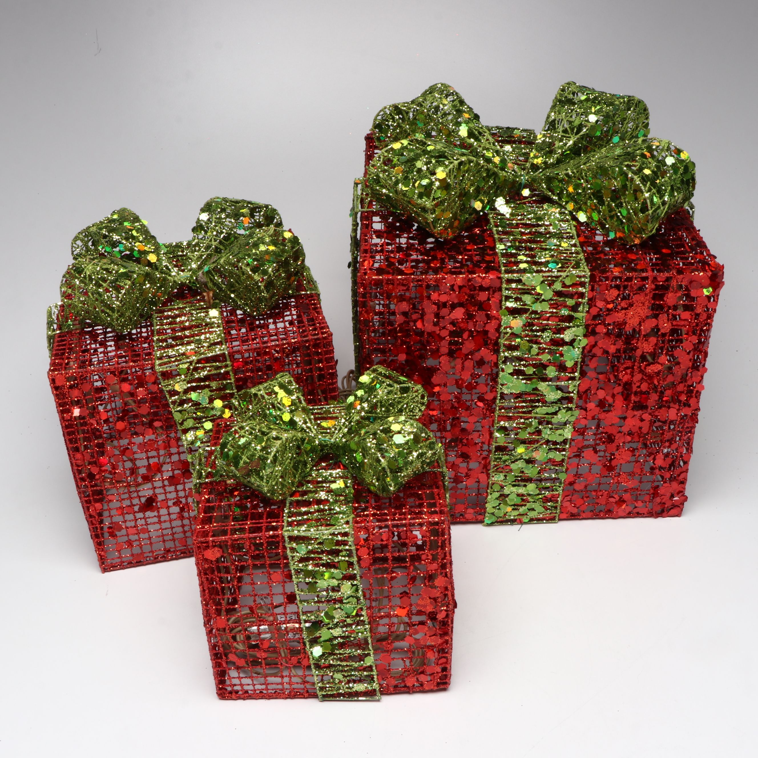 Karen Didion and Other Santa Figurines with Illuminated Gift Box Holiday Décor