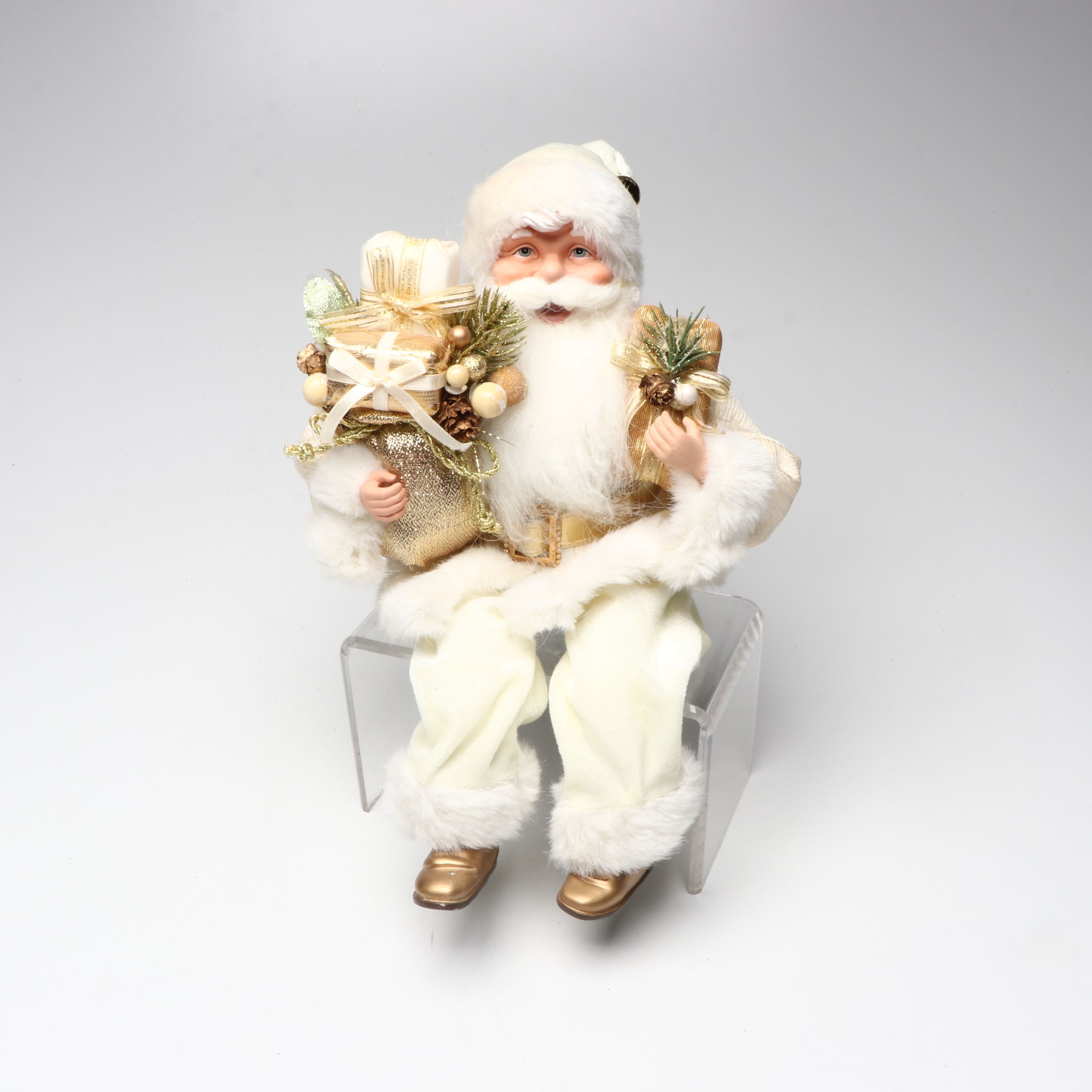 Karen Didion and Other Santa Figurines with Illuminated Gift Box Holiday Décor