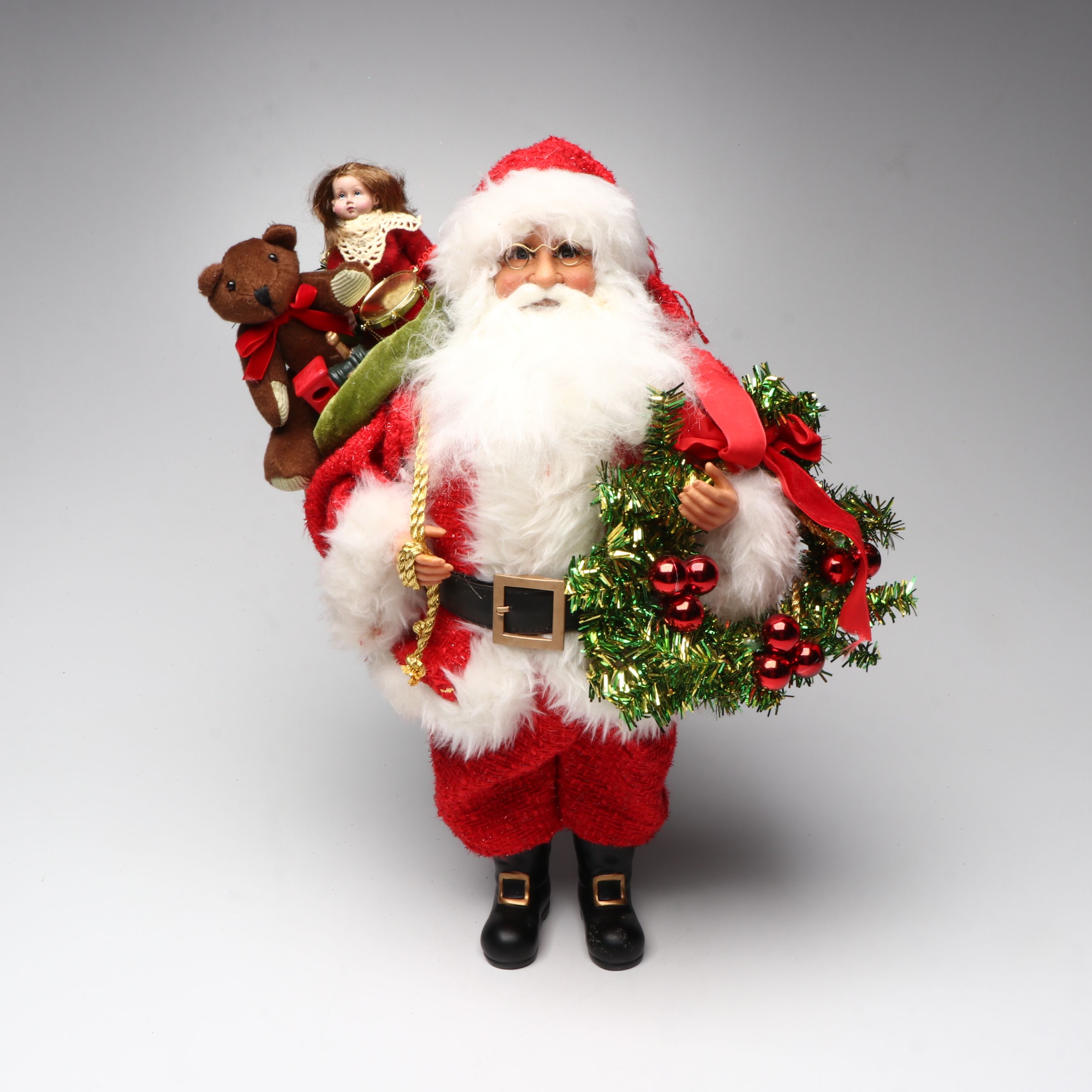 Karen Didion and Other Santa Figurines with Illuminated Gift Box Holiday Décor