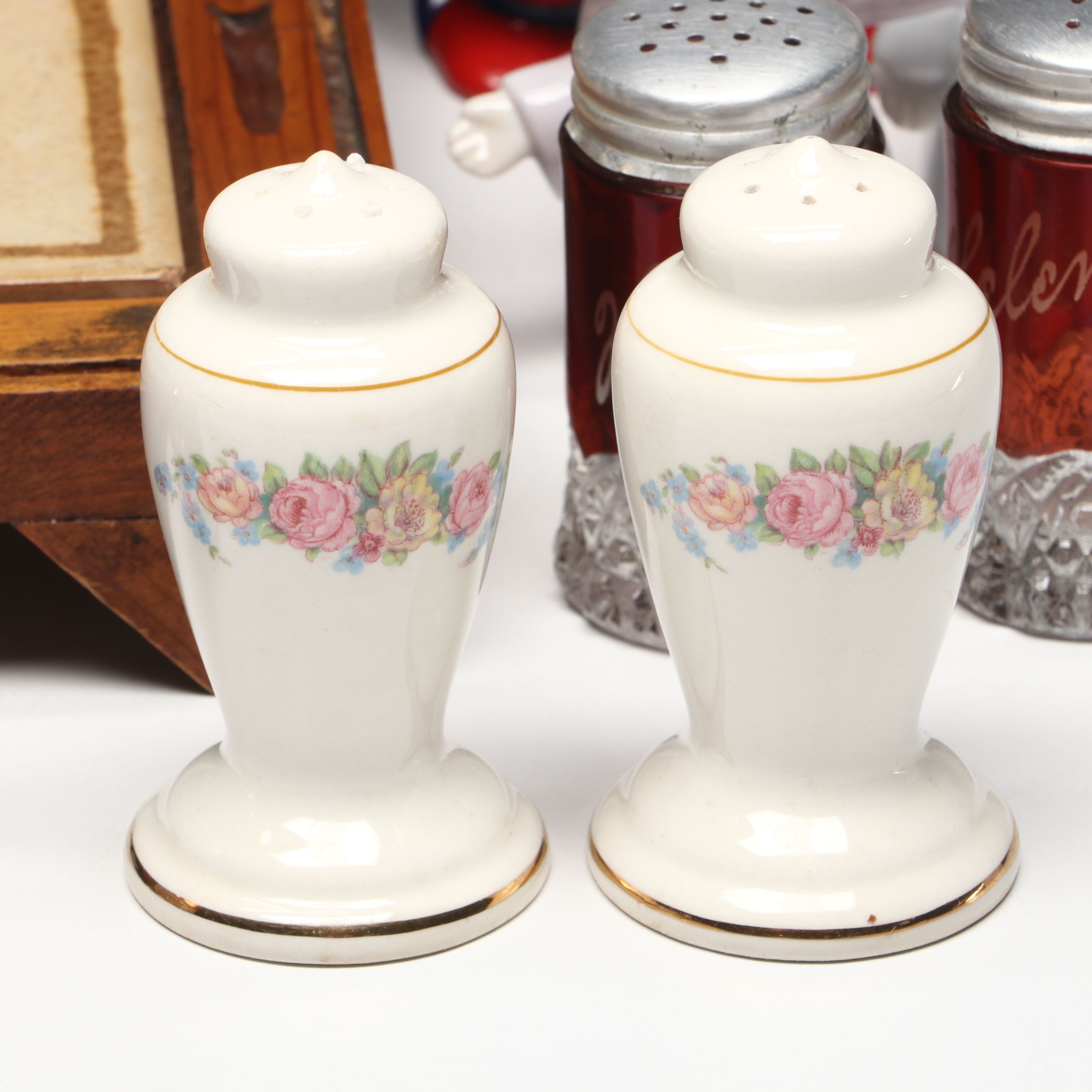 Collection of Glass, Porcelain, and More Shakers with Ceramic Table Trivet