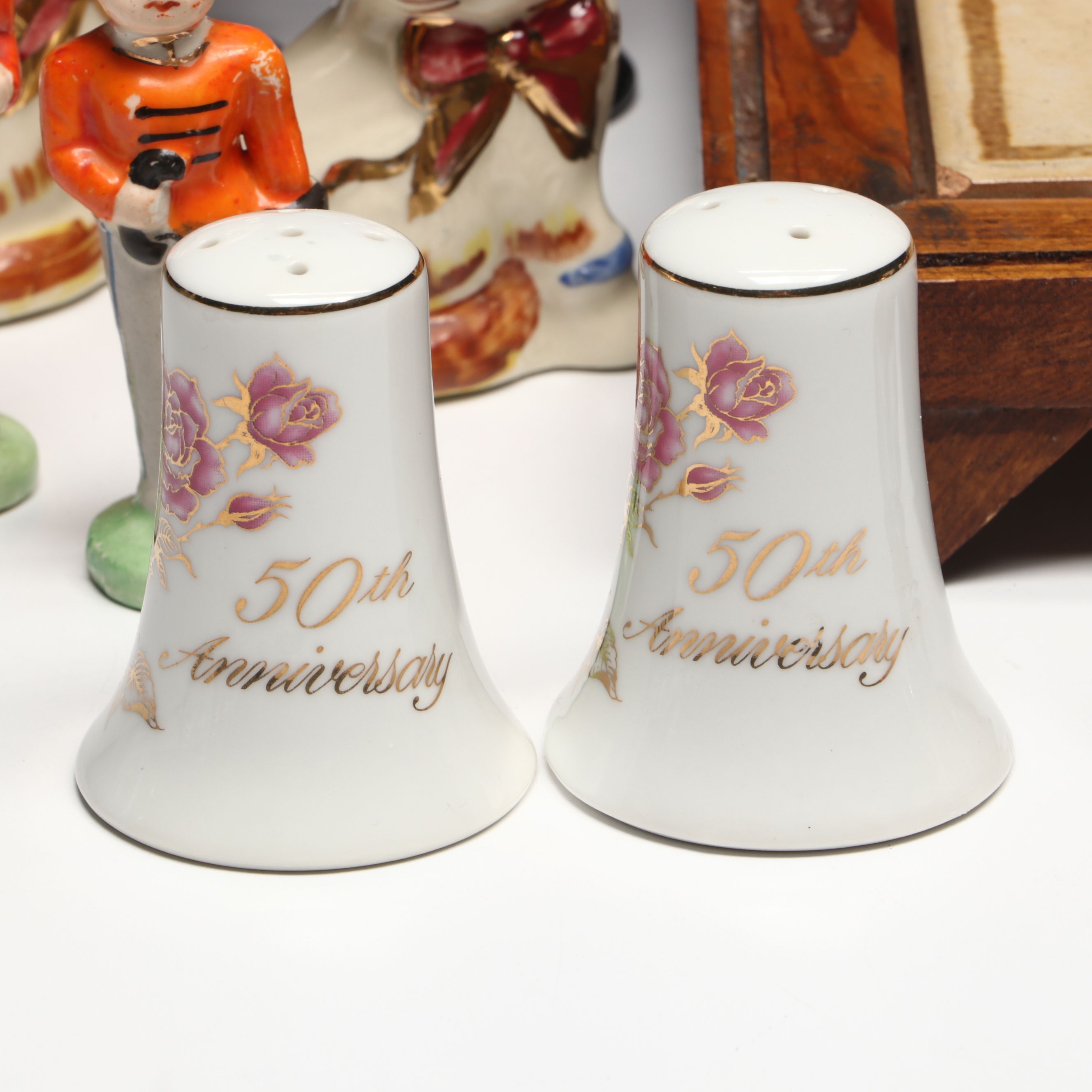 Collection of Glass, Porcelain, and More Shakers with Ceramic Table Trivet