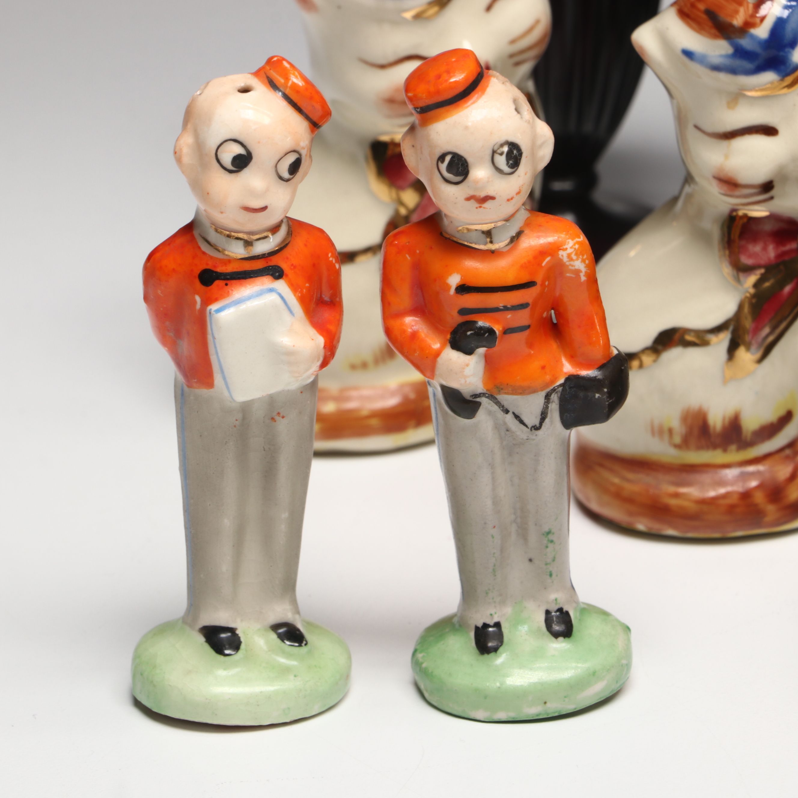 Collection of Glass, Porcelain, and More Shakers with Ceramic Table Trivet