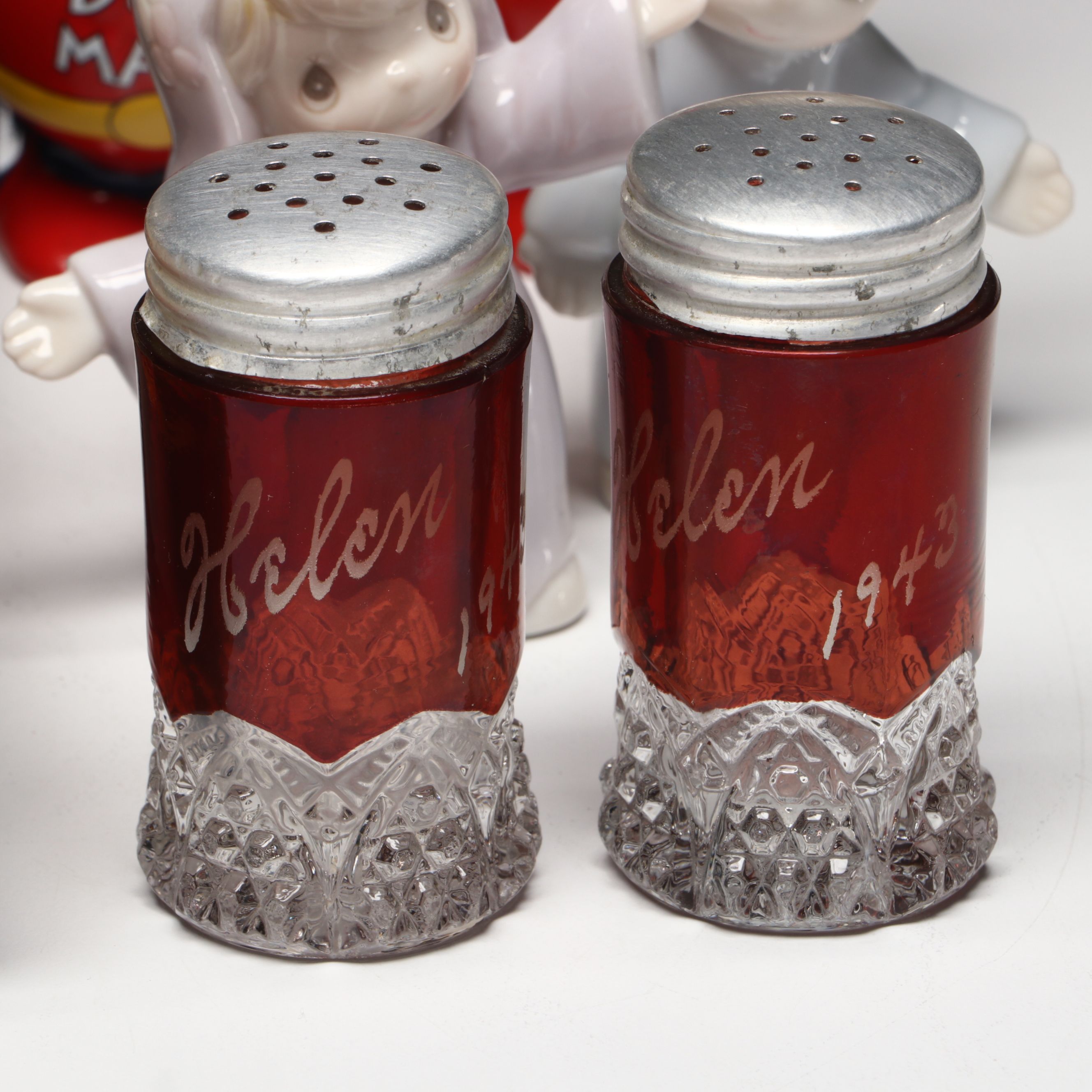 Collection of Glass, Porcelain, and More Shakers with Ceramic Table Trivet