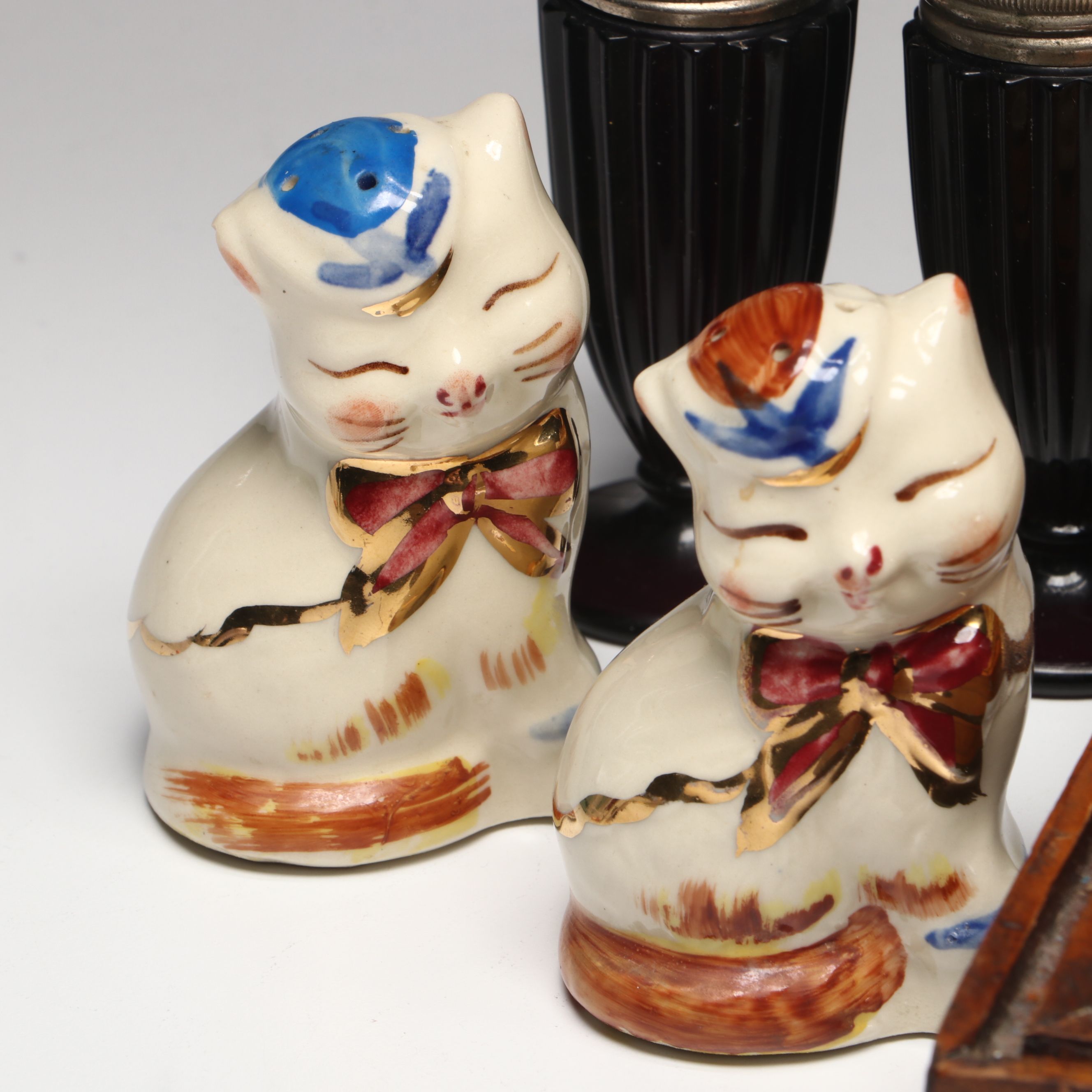 Collection of Glass, Porcelain, and More Shakers with Ceramic Table Trivet