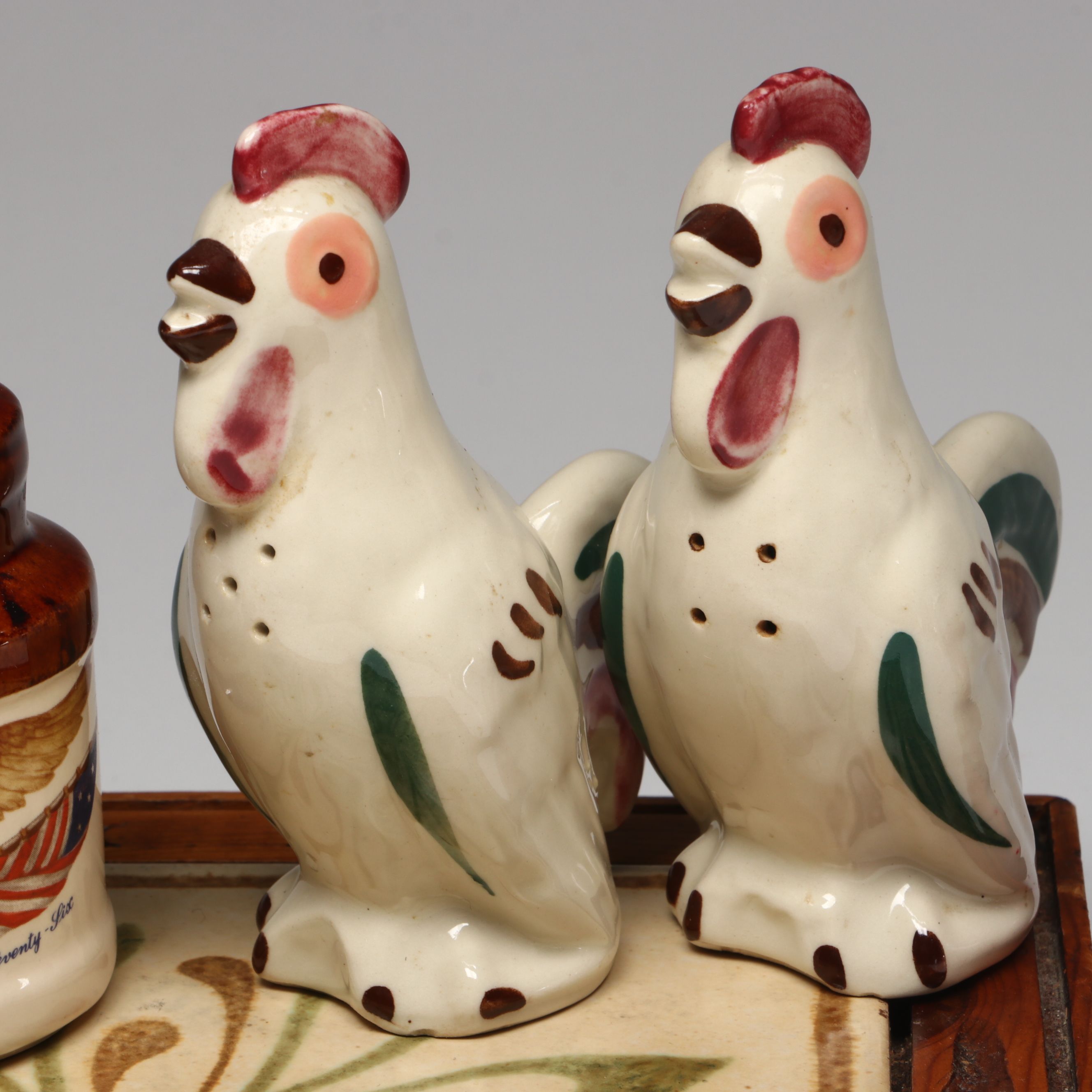 Collection of Glass, Porcelain, and More Shakers with Ceramic Table Trivet