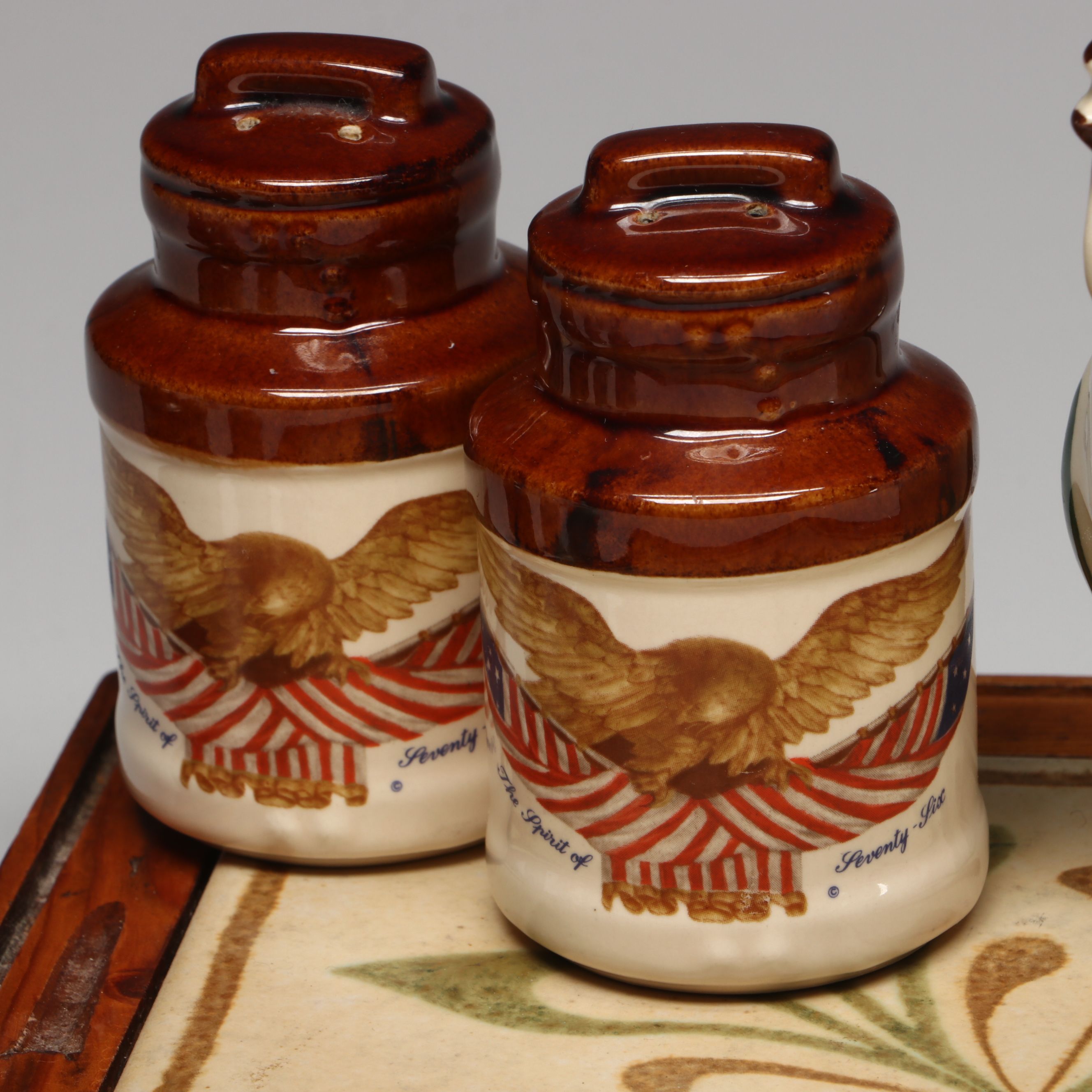 Collection of Glass, Porcelain, and More Shakers with Ceramic Table Trivet