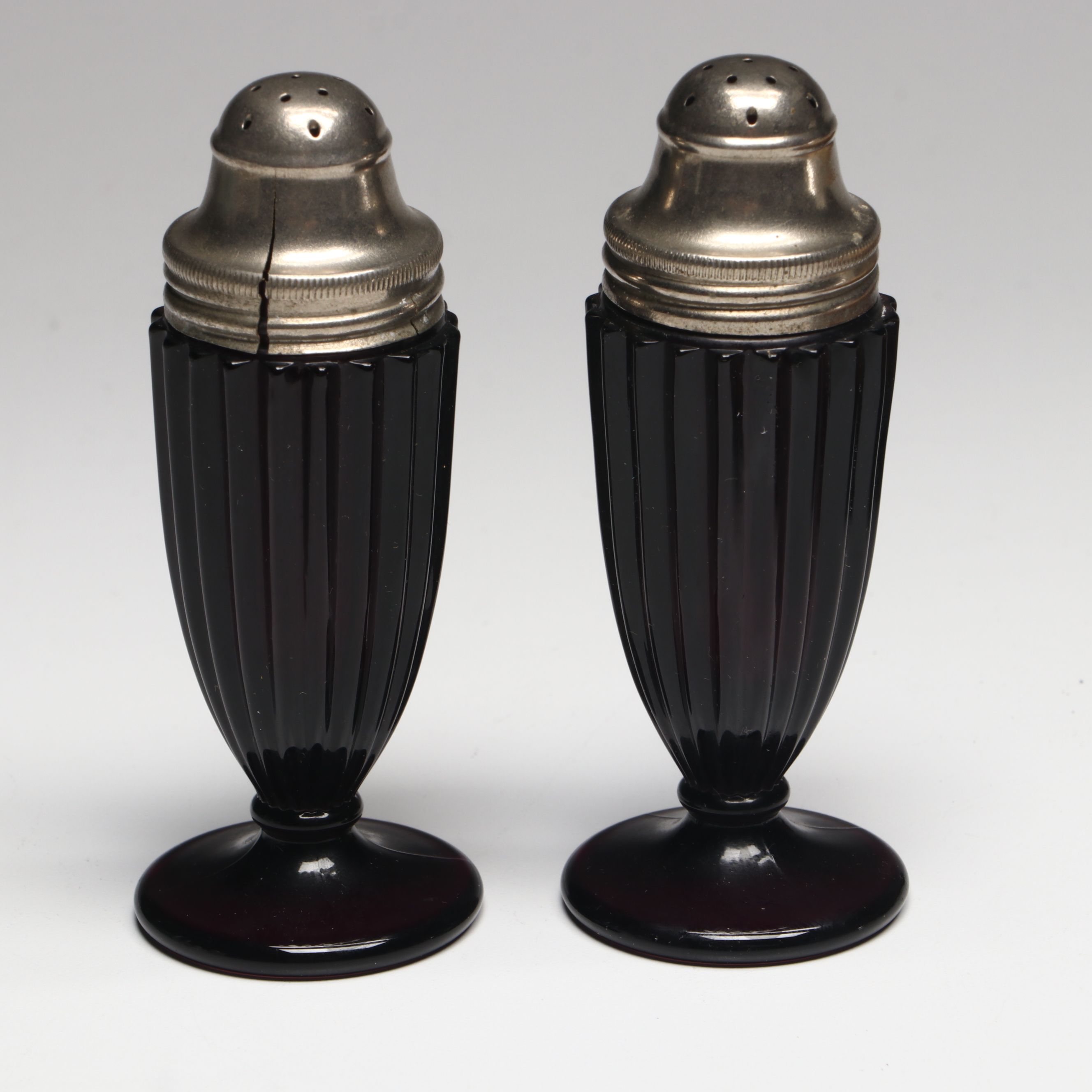 Collection of Glass, Porcelain, and More Shakers with Ceramic Table Trivet