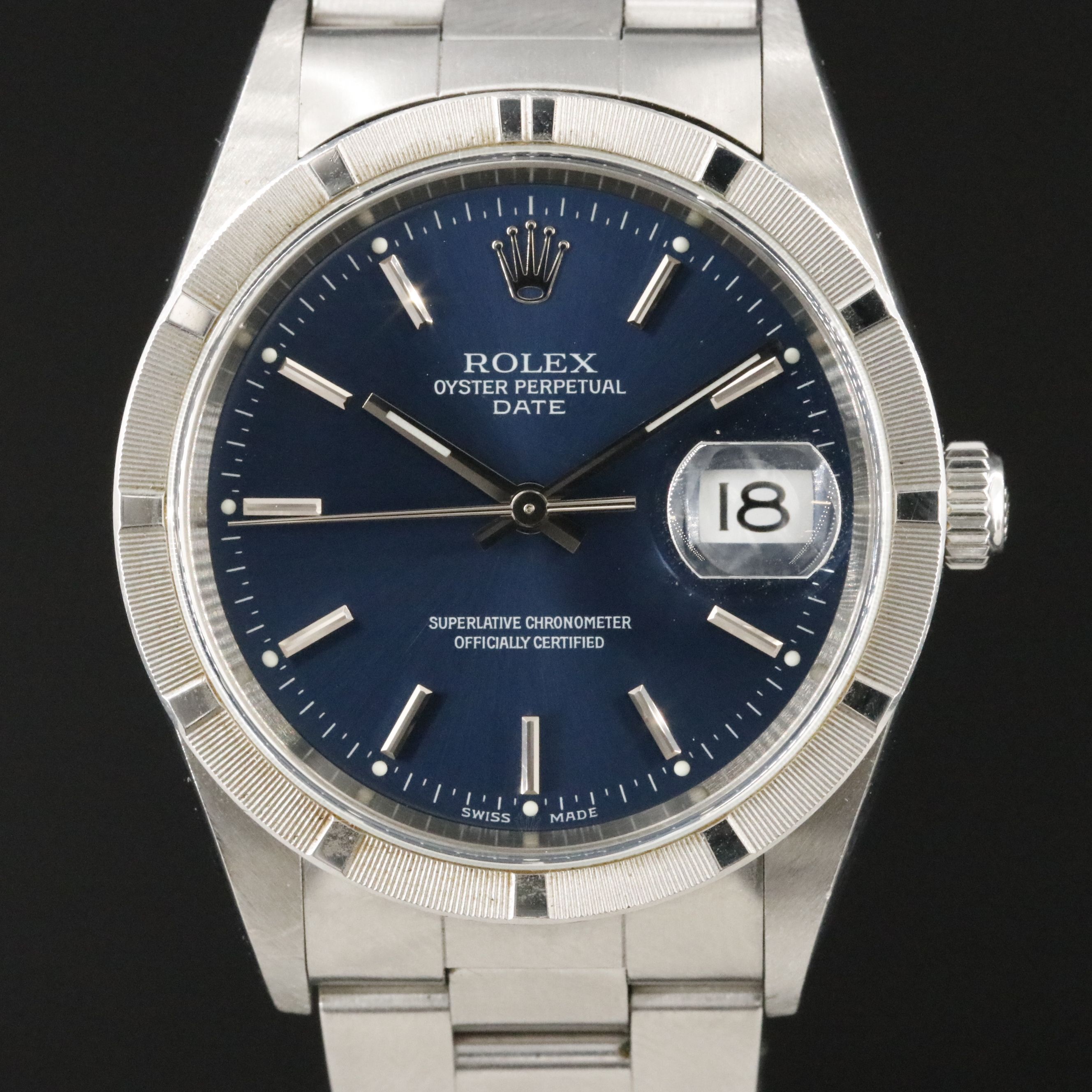 2002 Rolex Oyster Perpetual Engine Turned Bezel Blue Dial Date Ref. 15210 Watch