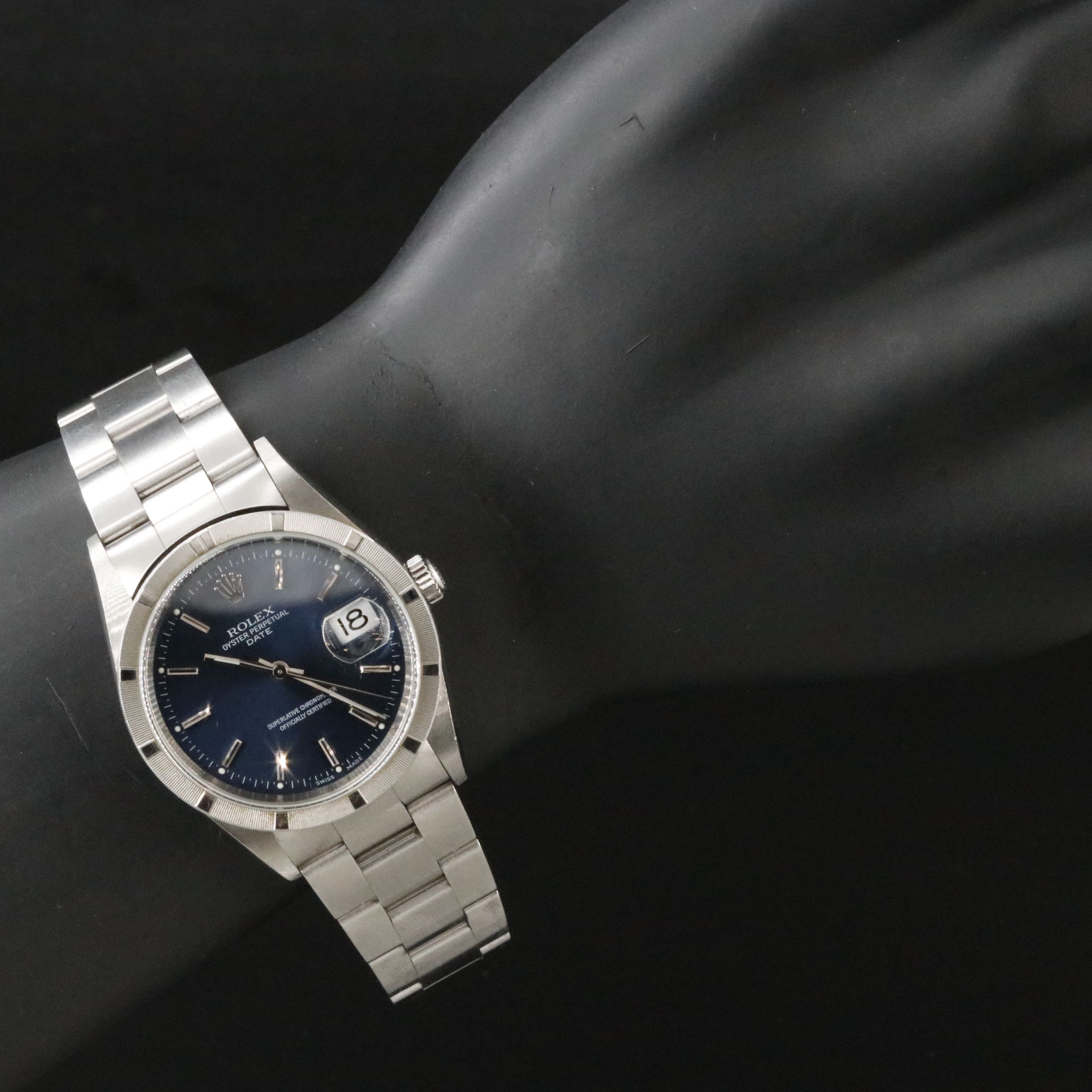 2002 Rolex Oyster Perpetual Engine Turned Bezel Blue Dial Date Ref. 15210 Watch