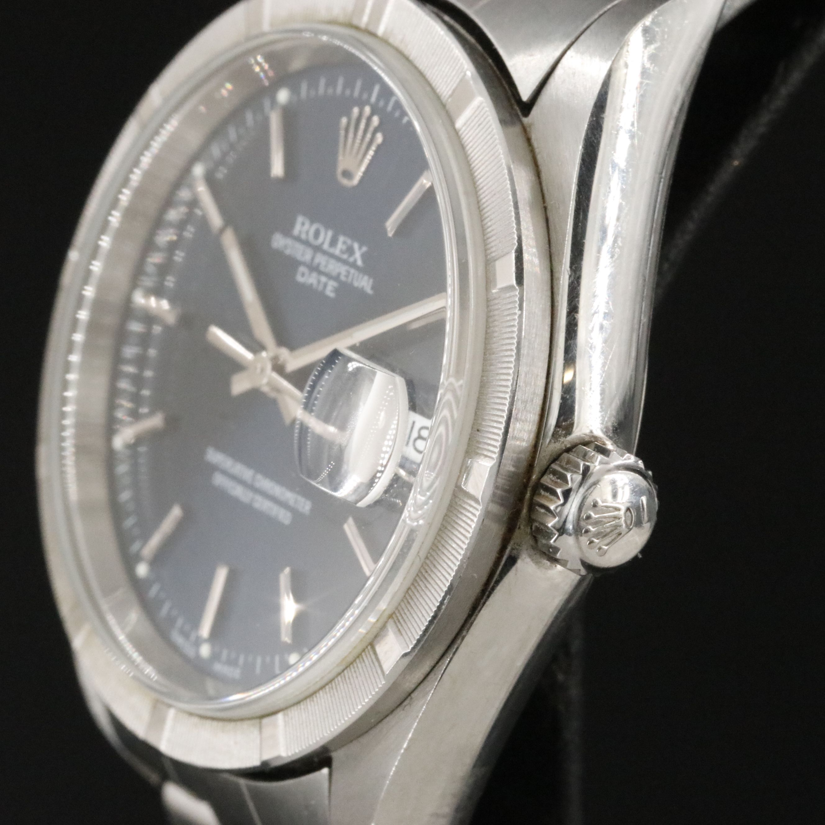 2002 Rolex Oyster Perpetual Engine Turned Bezel Blue Dial Date Ref. 15210 Watch