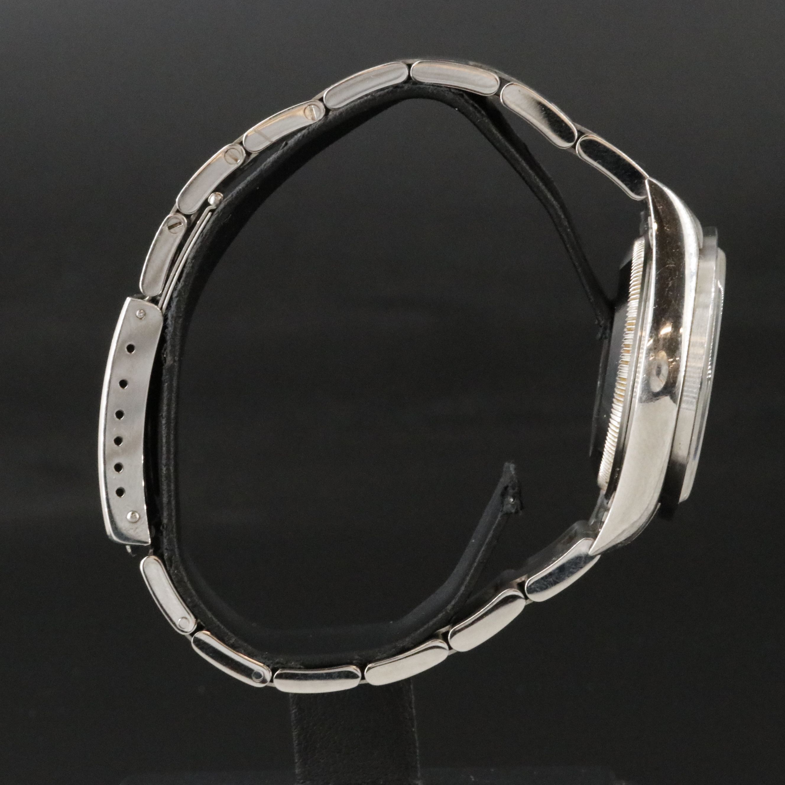 2002 Rolex Oyster Perpetual Engine Turned Bezel Blue Dial Date Ref. 15210 Watch