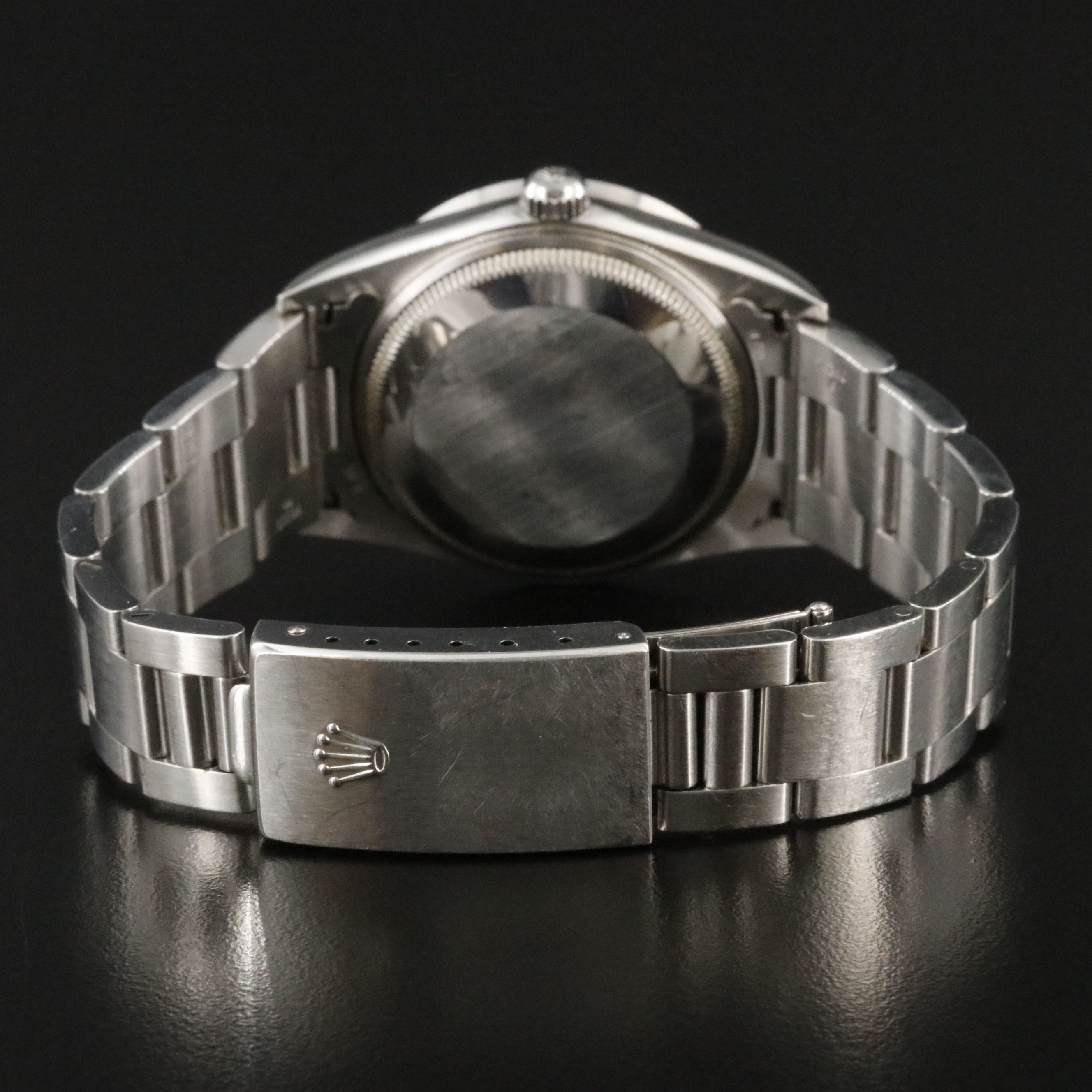 2002 Rolex Oyster Perpetual Engine Turned Bezel Blue Dial Date Ref. 15210 Watch