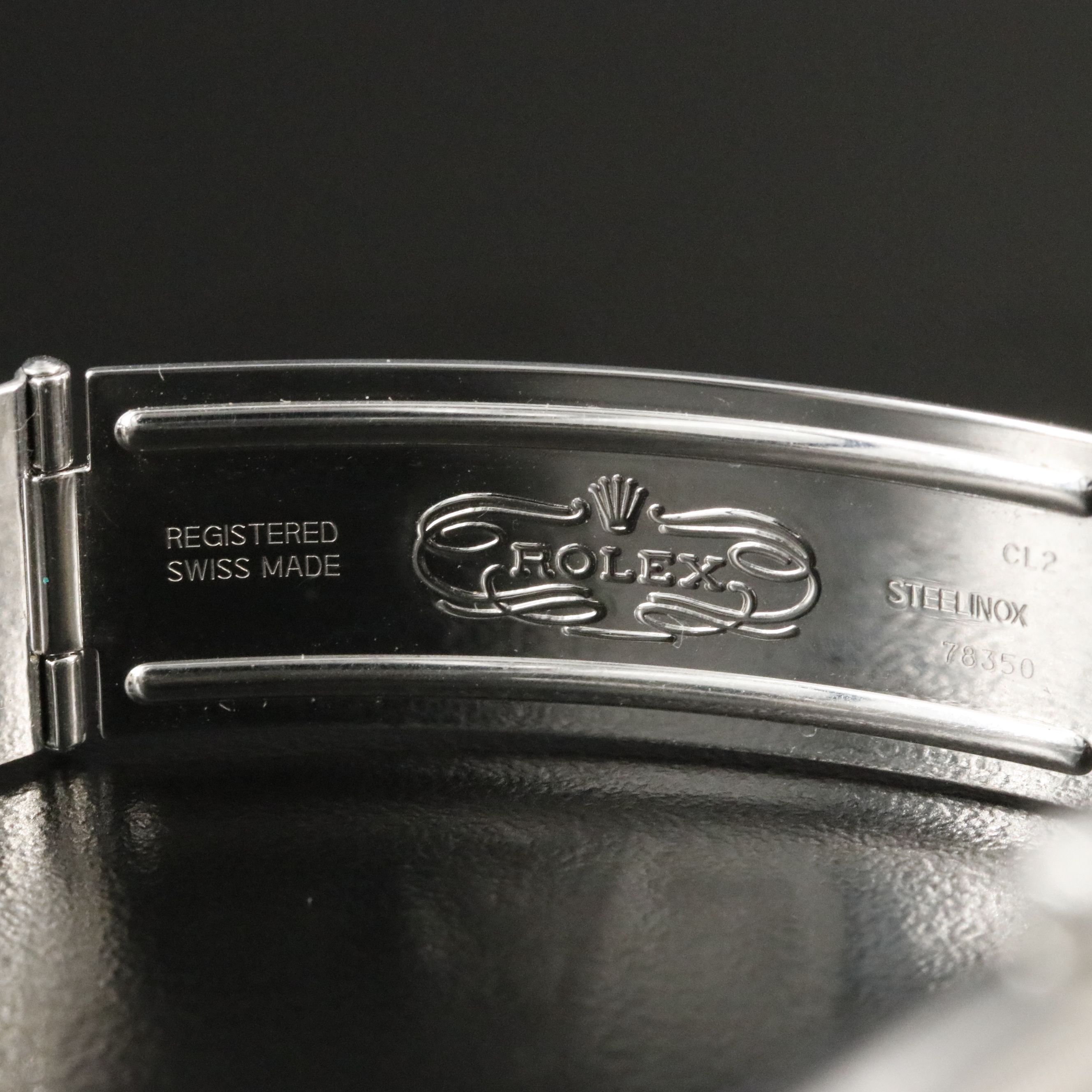 2002 Rolex Oyster Perpetual Engine Turned Bezel Blue Dial Date Ref. 15210 Watch