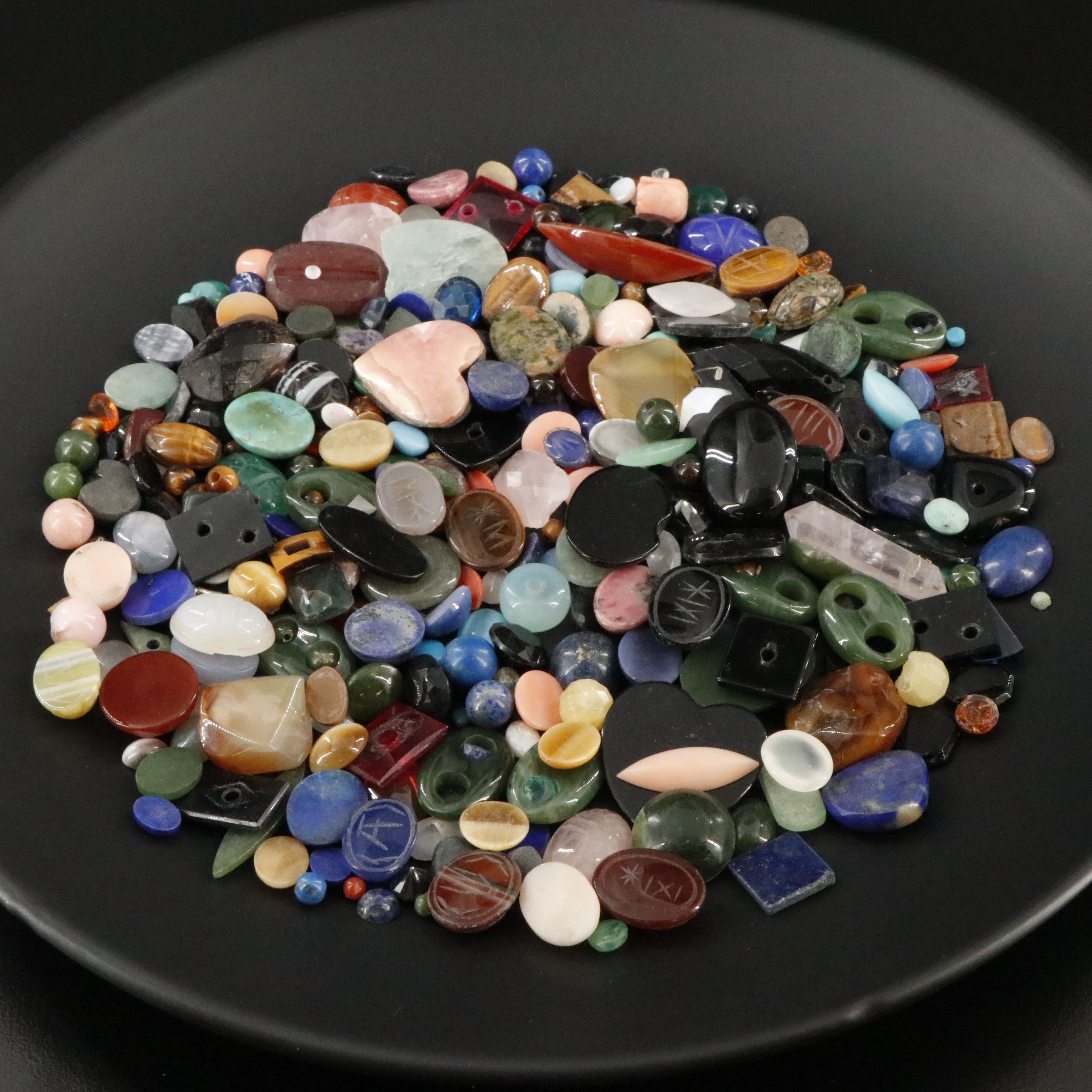 Loose Gemstone Lot Including Tiger's Eye, Rhodochrosite and Coral