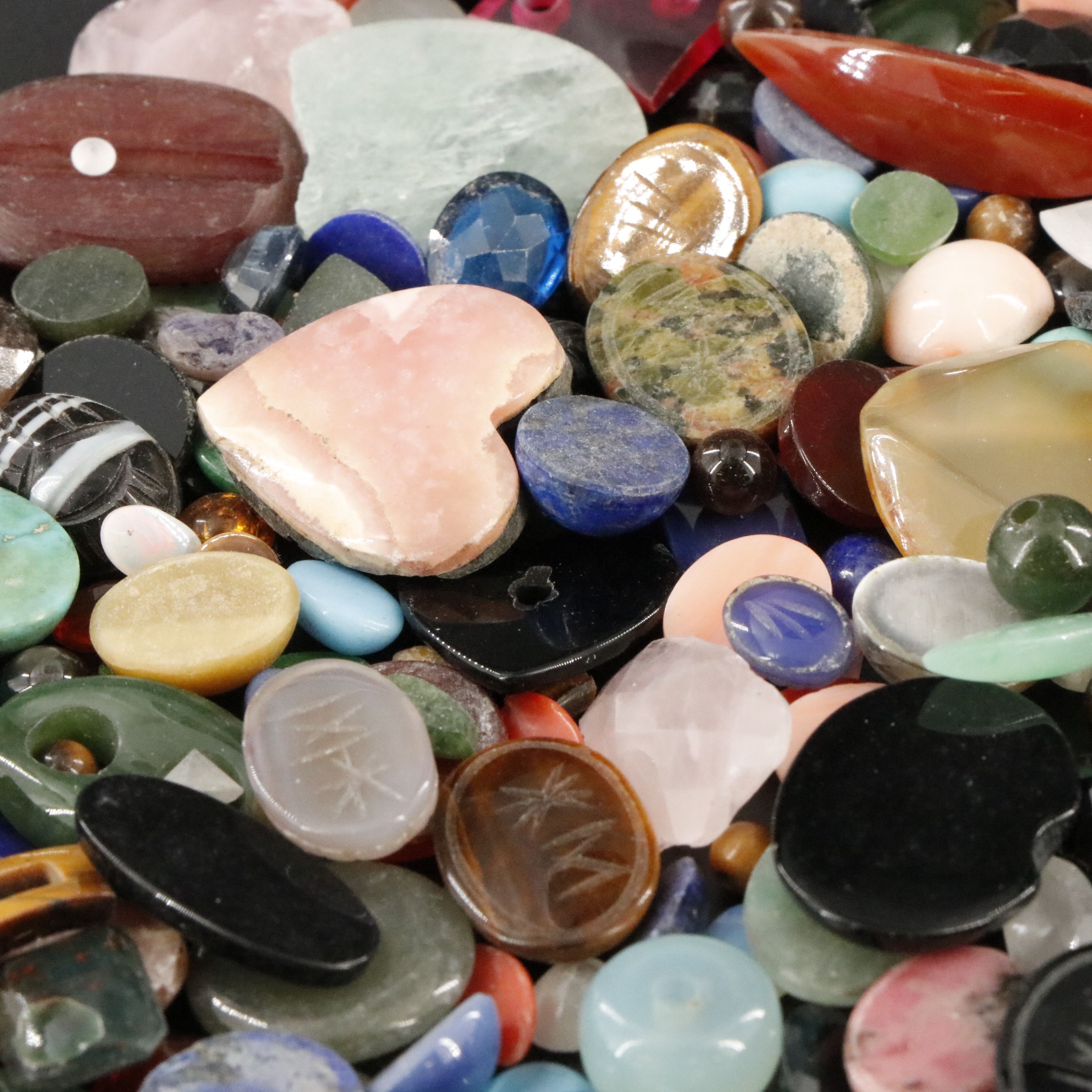 Loose Gemstone Lot Including Tiger's Eye, Rhodochrosite and Coral