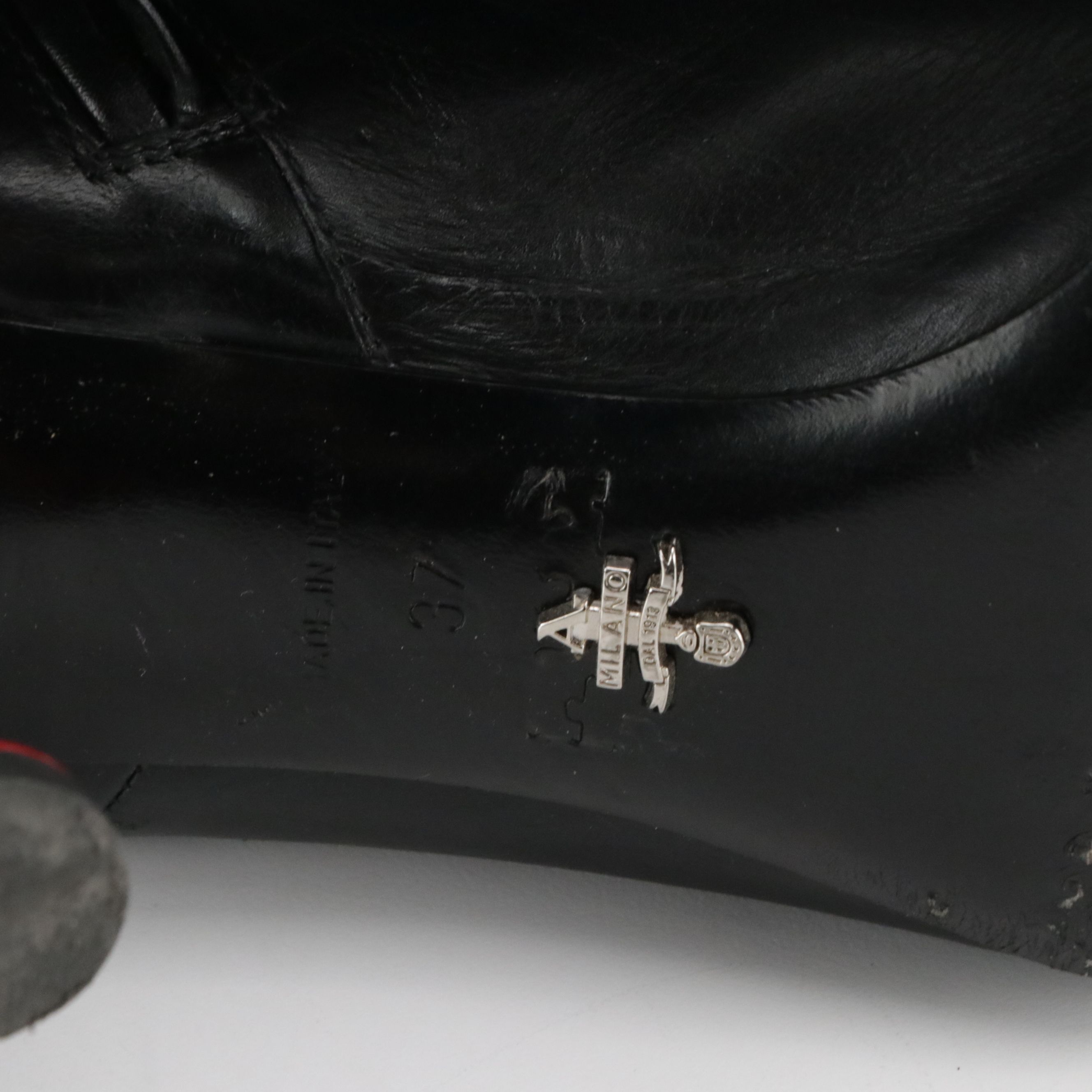 Prada Pointed-Toe Booties in Black Leather with Red Accents