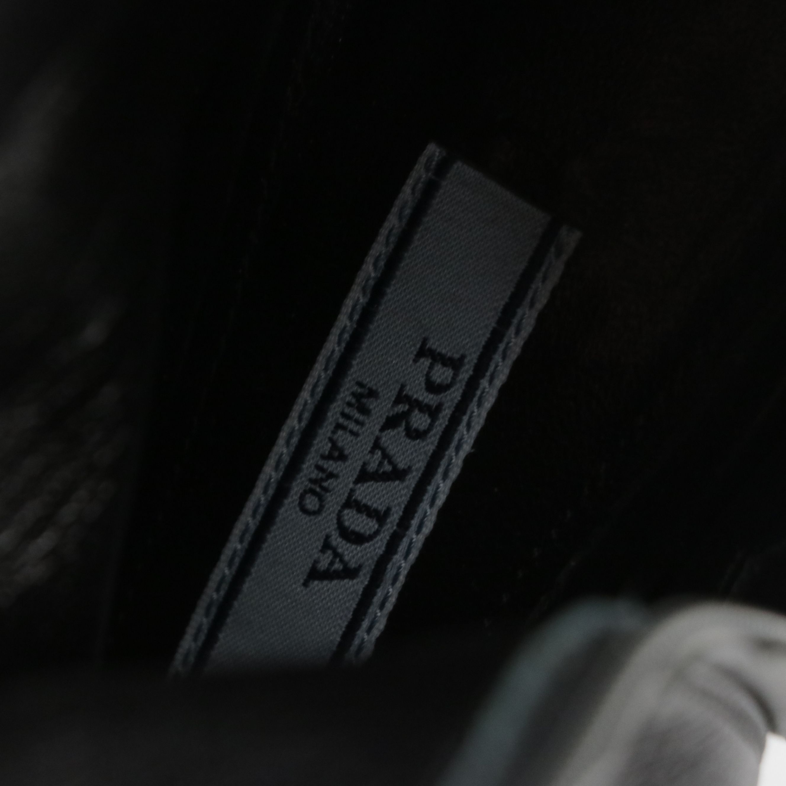 Prada Pointed-Toe Booties in Black Leather with Red Accents